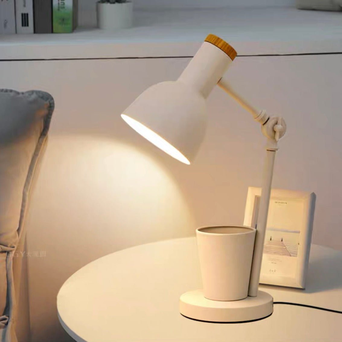 Modern metal desk lamp with an integrated pen holder, showcasing a sleek design and vibrant colors.