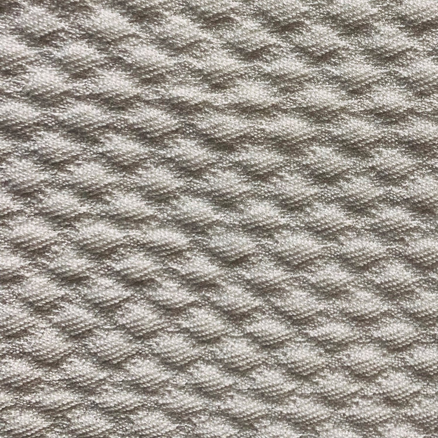 Monroe Bisque Brown Dobby Luxury Throw Pillow showcasing its elegant dobby pattern and durable Sunbrella fabric, perfect for indoor and outdoor use.