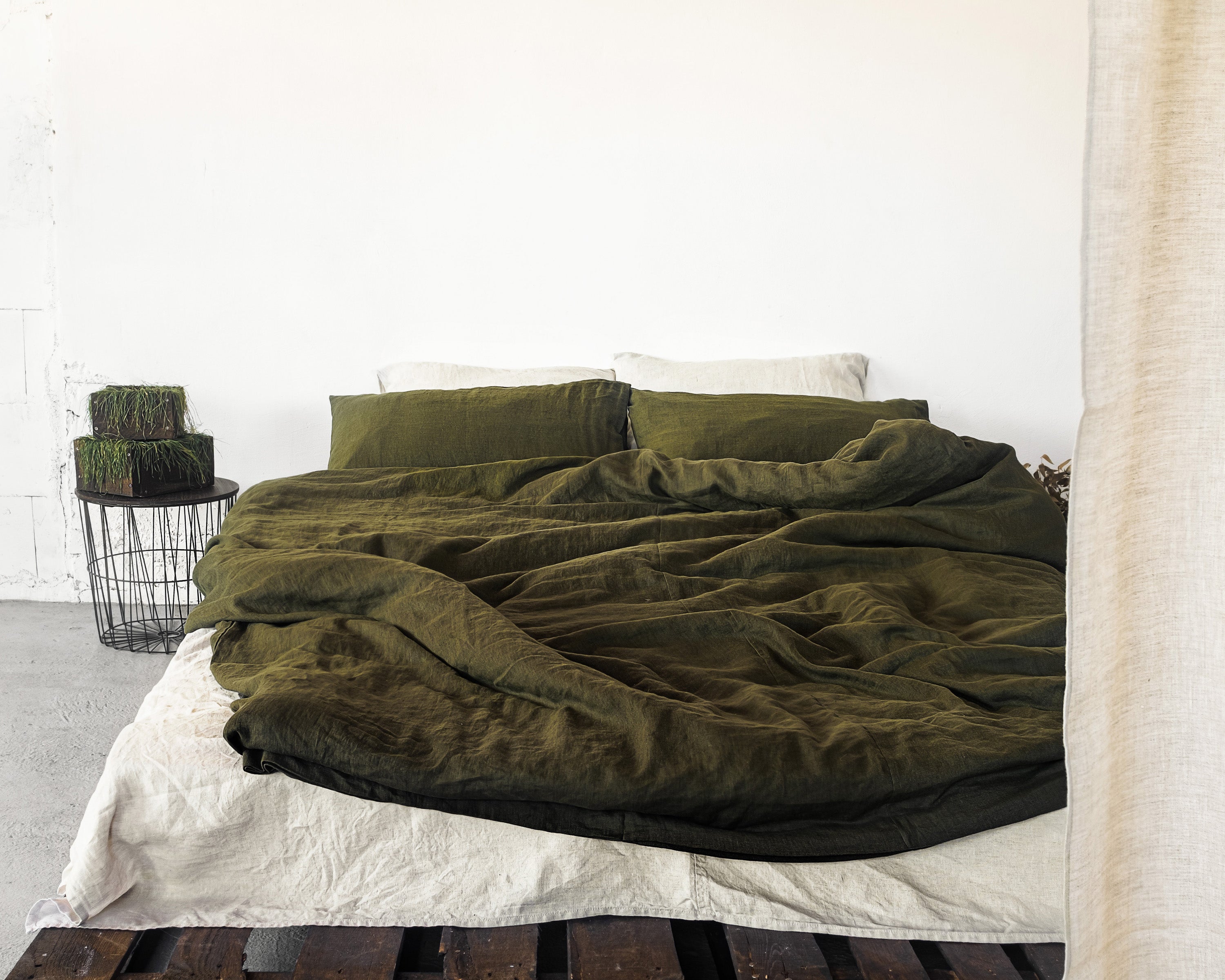 Moss Green linen bedding set featuring a duvet cover with zipper closure, bedsheet, and pillowcases, showcasing a minimalist Scandinavian design.