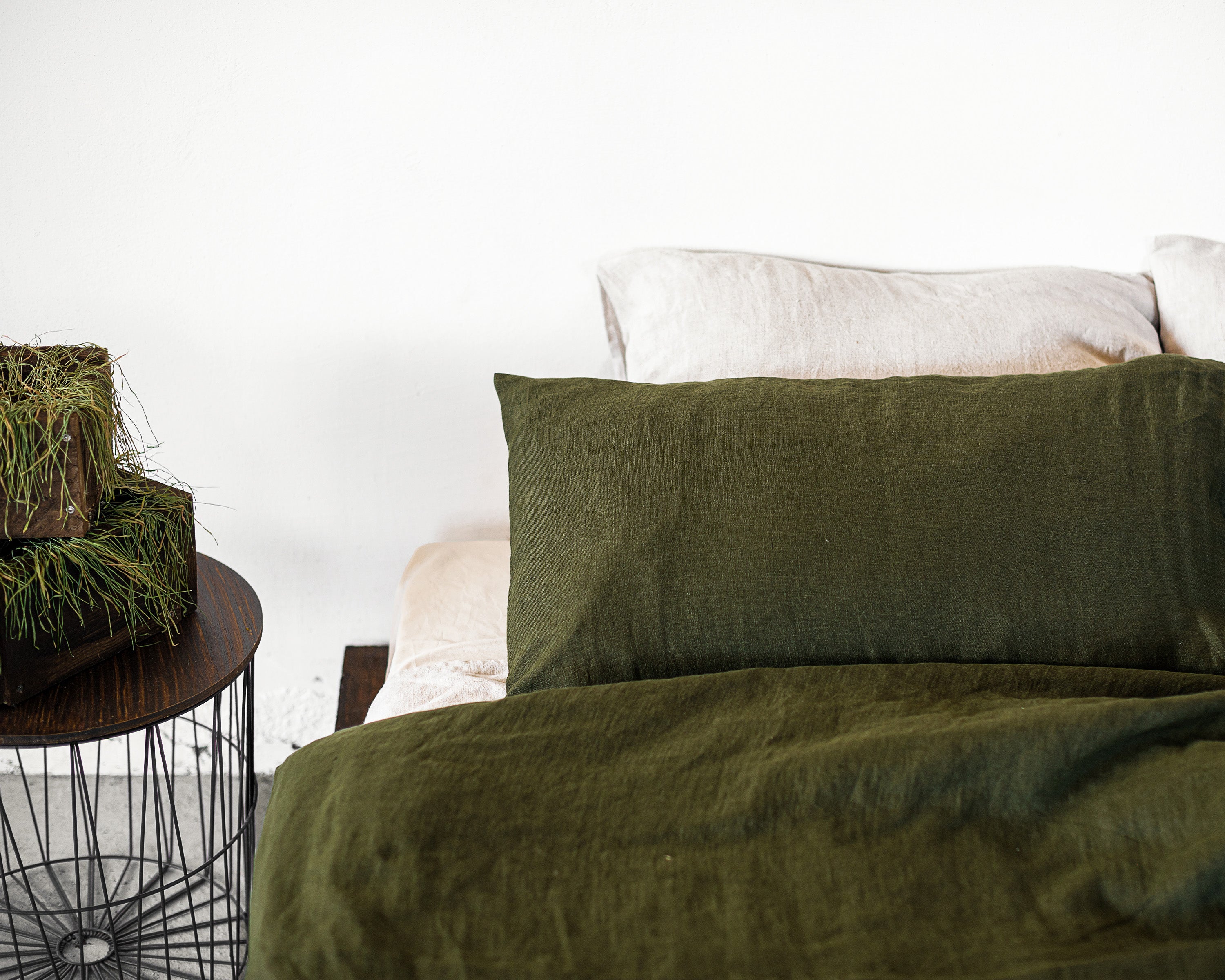 Moss Green linen bedding set featuring a duvet cover with zipper closure, bedsheet, and pillowcases, showcasing a minimalist Scandinavian design.