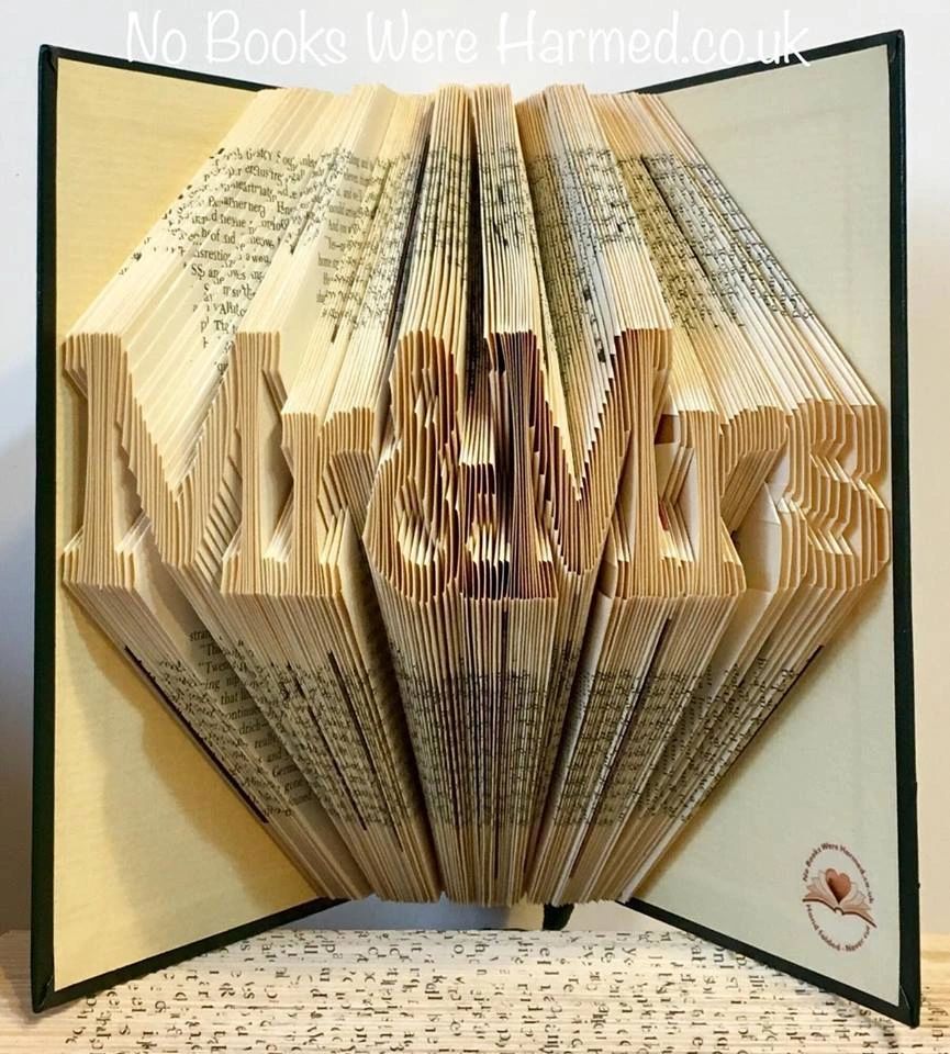 Handcrafted 'Mr&Mrs' book art made from vintage pages, showcasing unique design and eco-friendly craftsmanship.