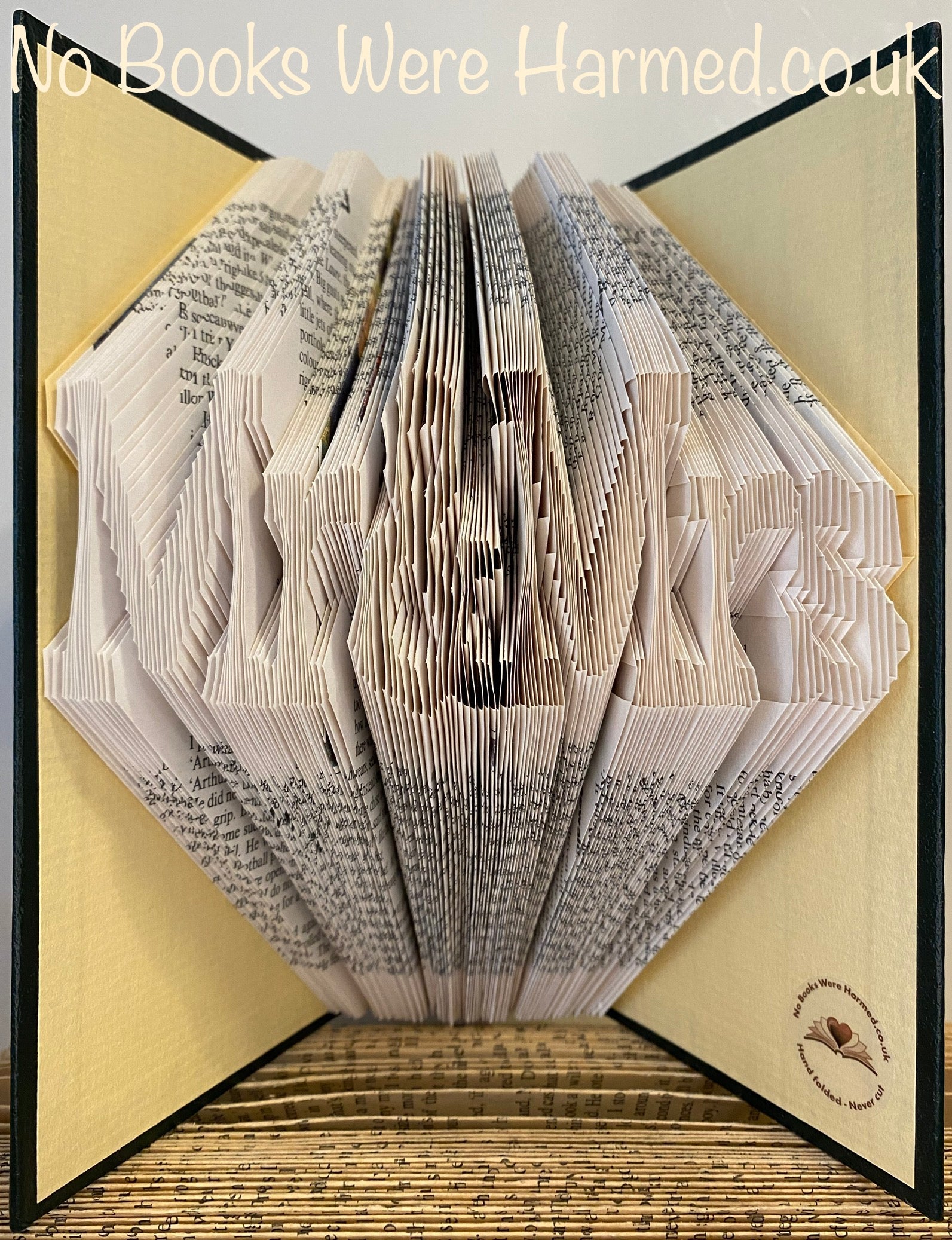 Handcrafted 'Mr&Mrs' book art made from vintage pages, showcasing unique design and eco-friendly craftsmanship.