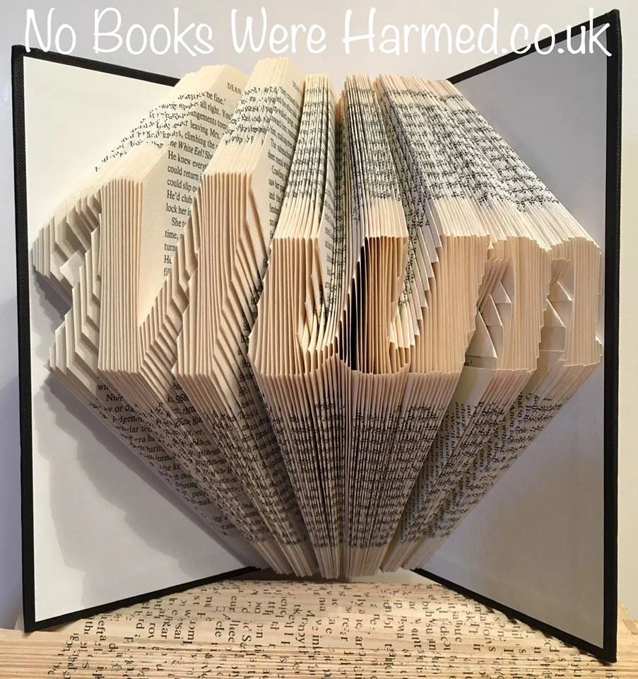 Hand-folded book art piece titled 'Mum', showcasing intricate designs made from vintage book pages.