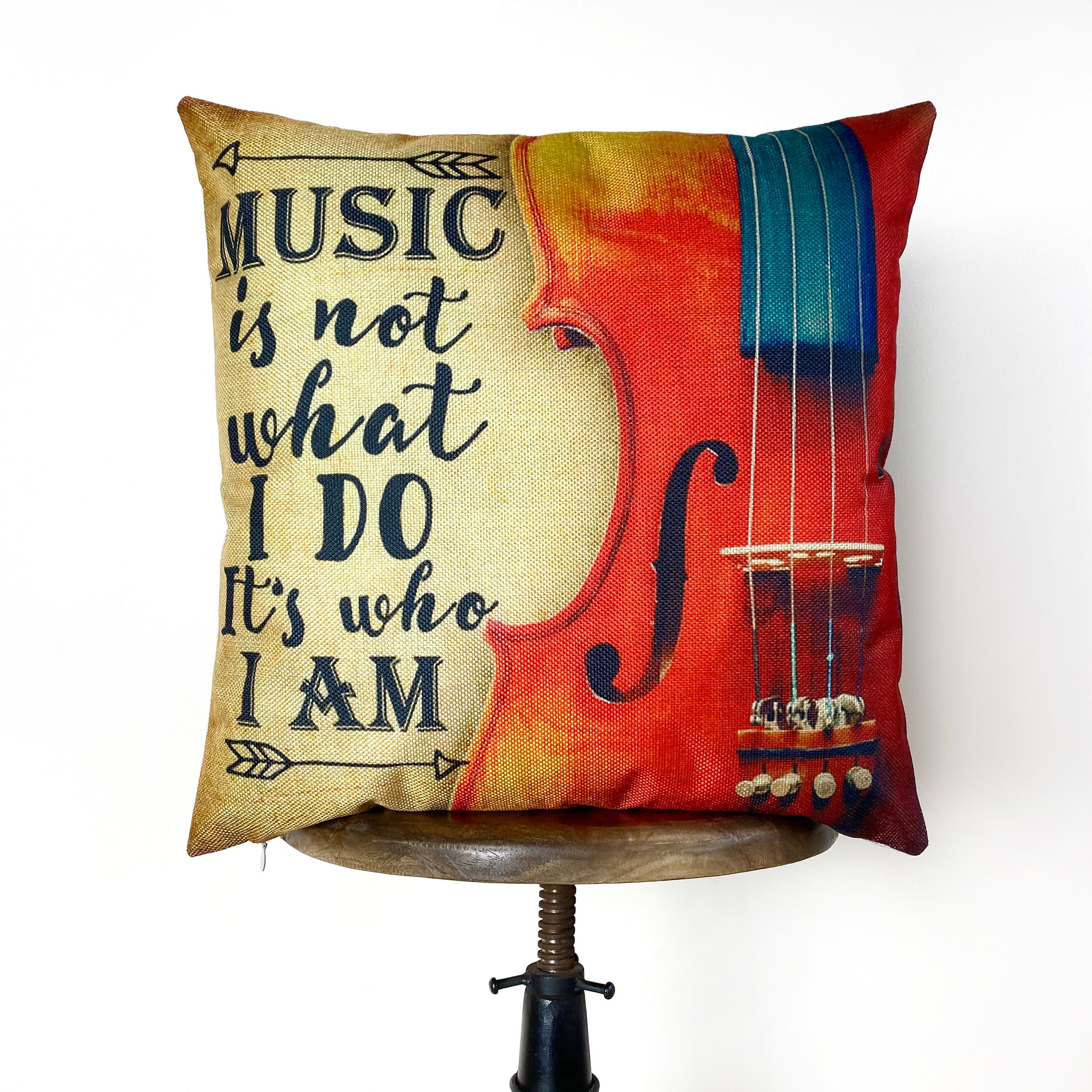 Handmade pillow cover featuring the phrase 'Music is not what I Do it's who I am' with a gold background and violin design.