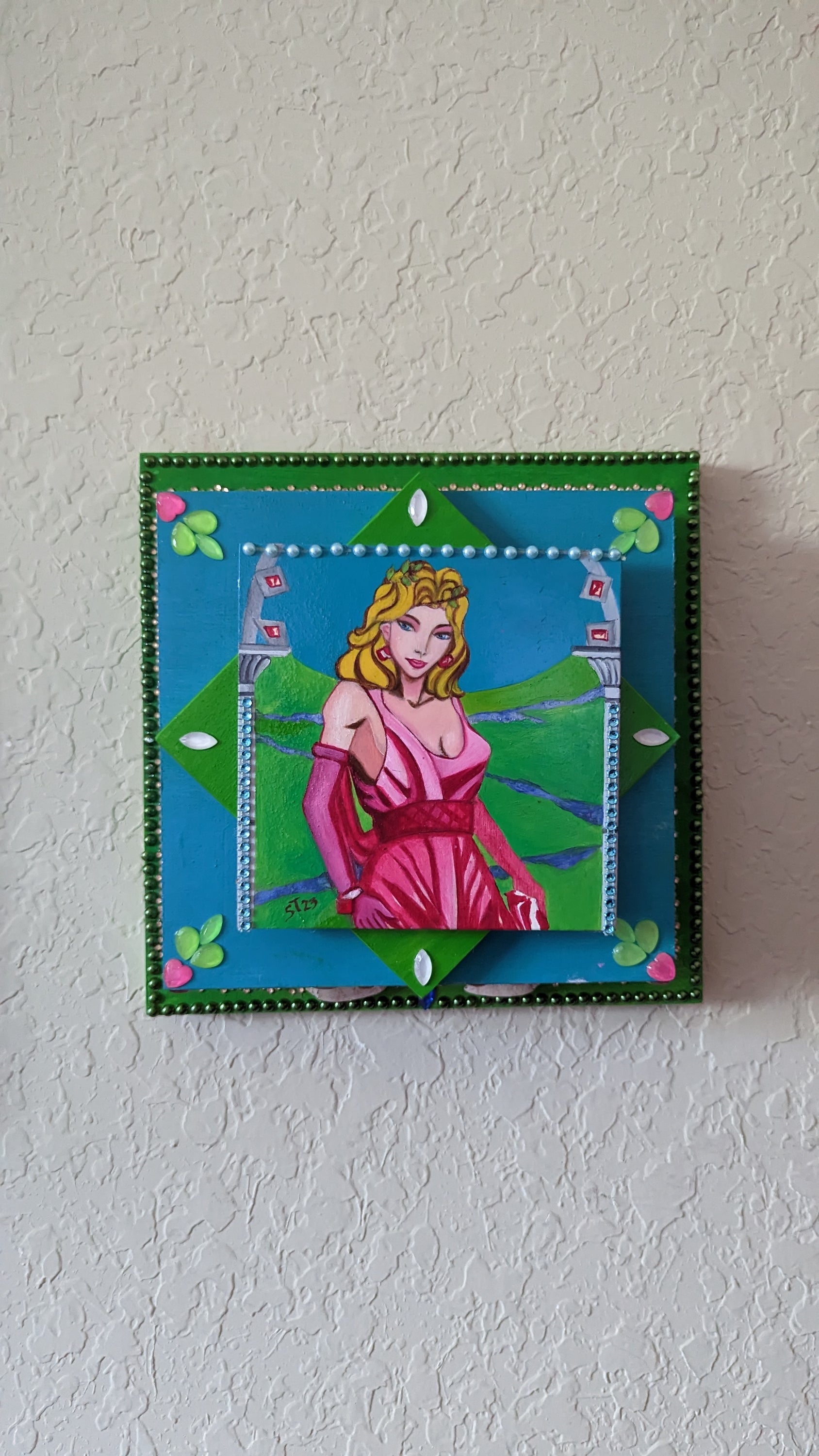 A beautifully hand-decorated Wish Box by Sharon Tatem featuring a powerful maiden, showcasing intricate designs and vibrant colors.
