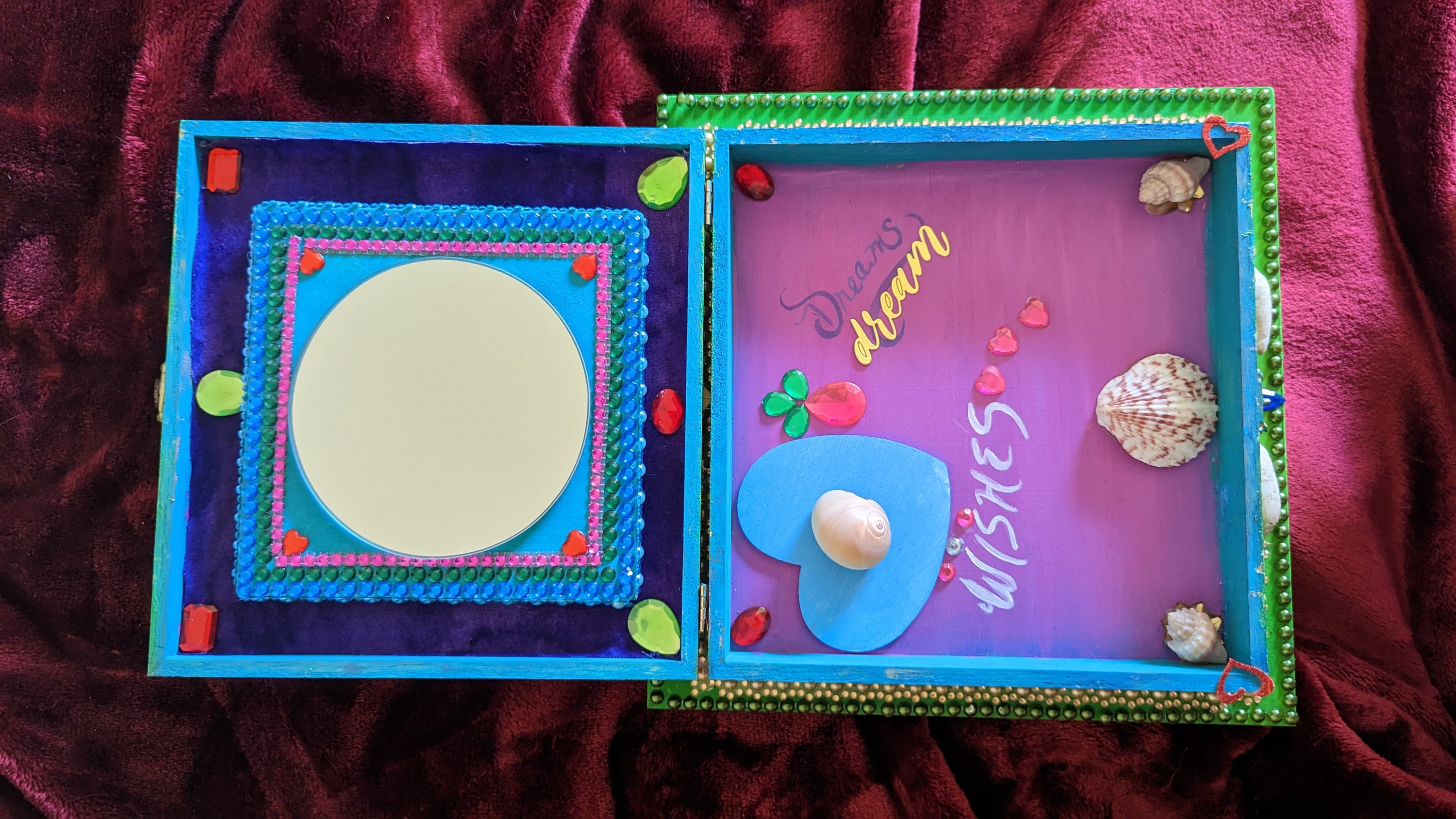 A beautifully hand-decorated Wish Box by Sharon Tatem featuring intricate designs and a powerful maiden, symbolizing dreams and wishes.