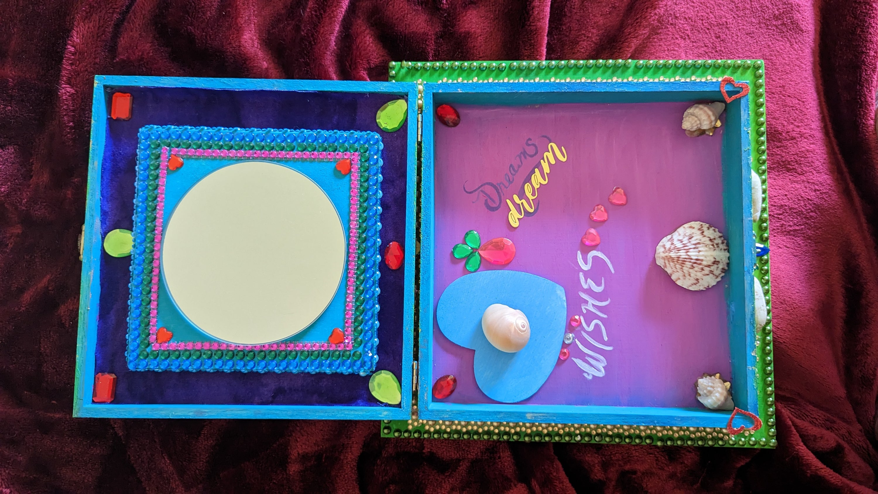 A beautifully hand-decorated Wish Box by Sharon Tatem featuring intricate designs and a powerful maiden, symbolizing dreams and wishes.