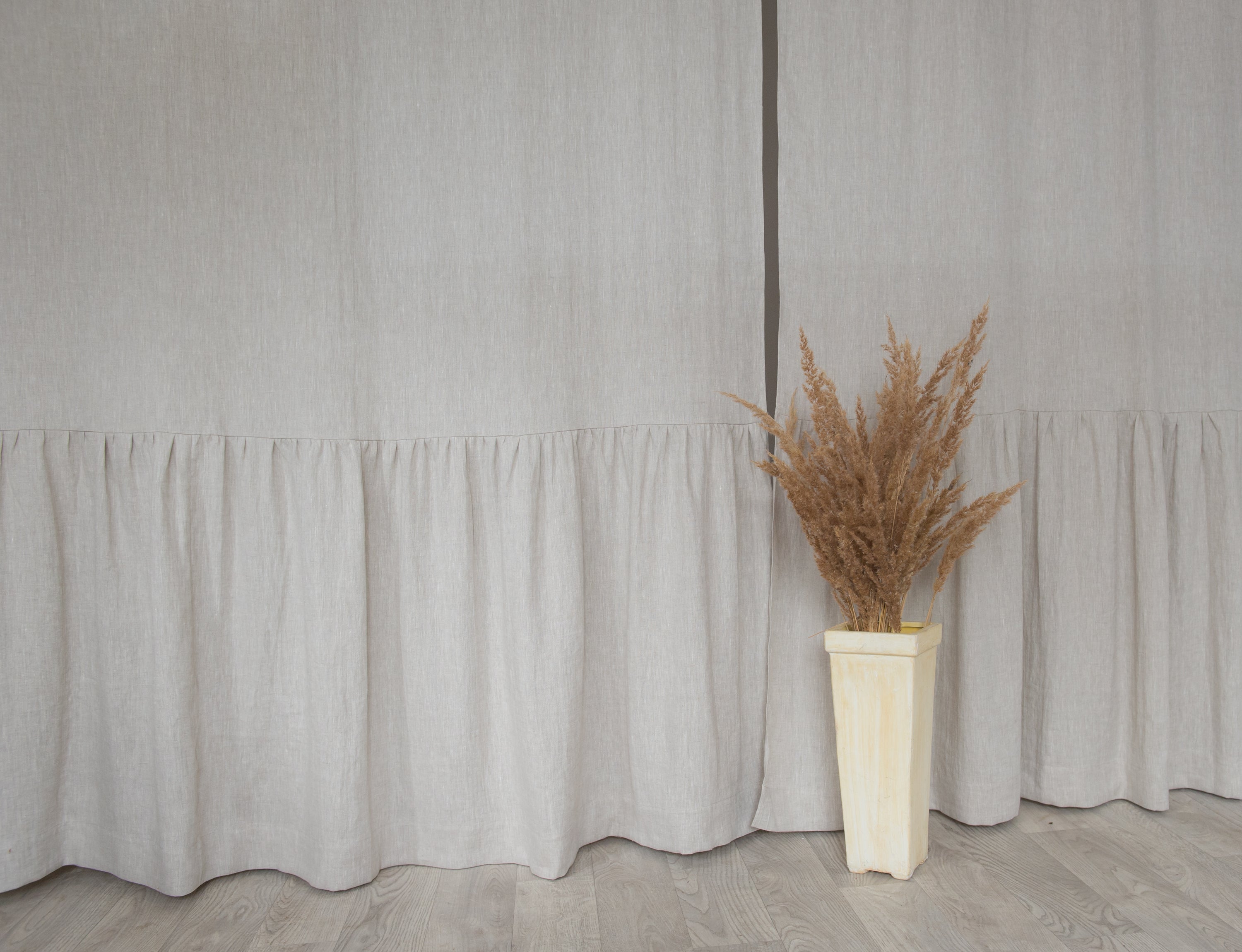 Natural Light linen curtain with ruffles, featuring a rod pocket for easy hanging, showcasing a soft, flowing design in a light color.