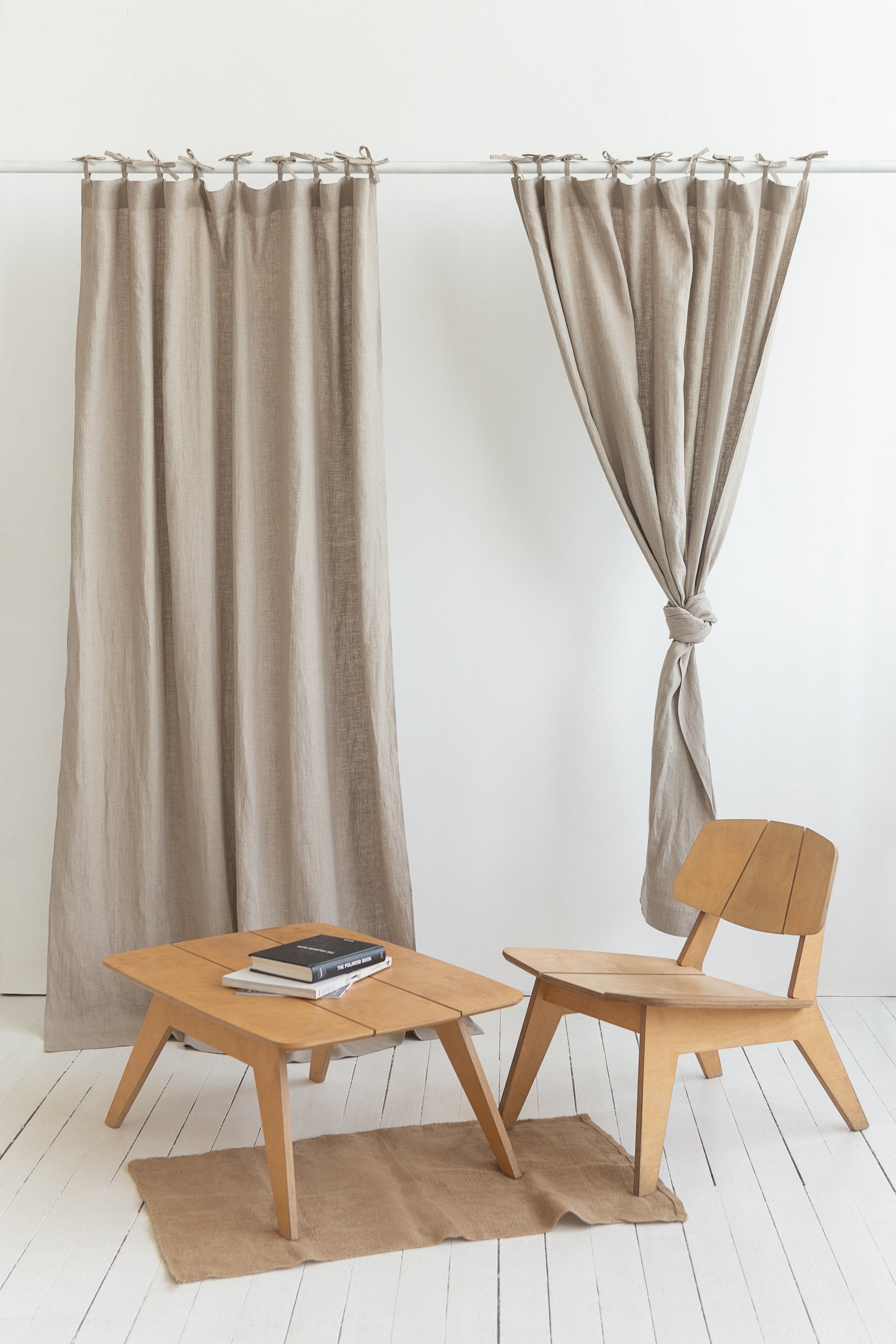 Elegant natural linen curtain with tie top design, showcasing soft texture and semi-sheer fabric.