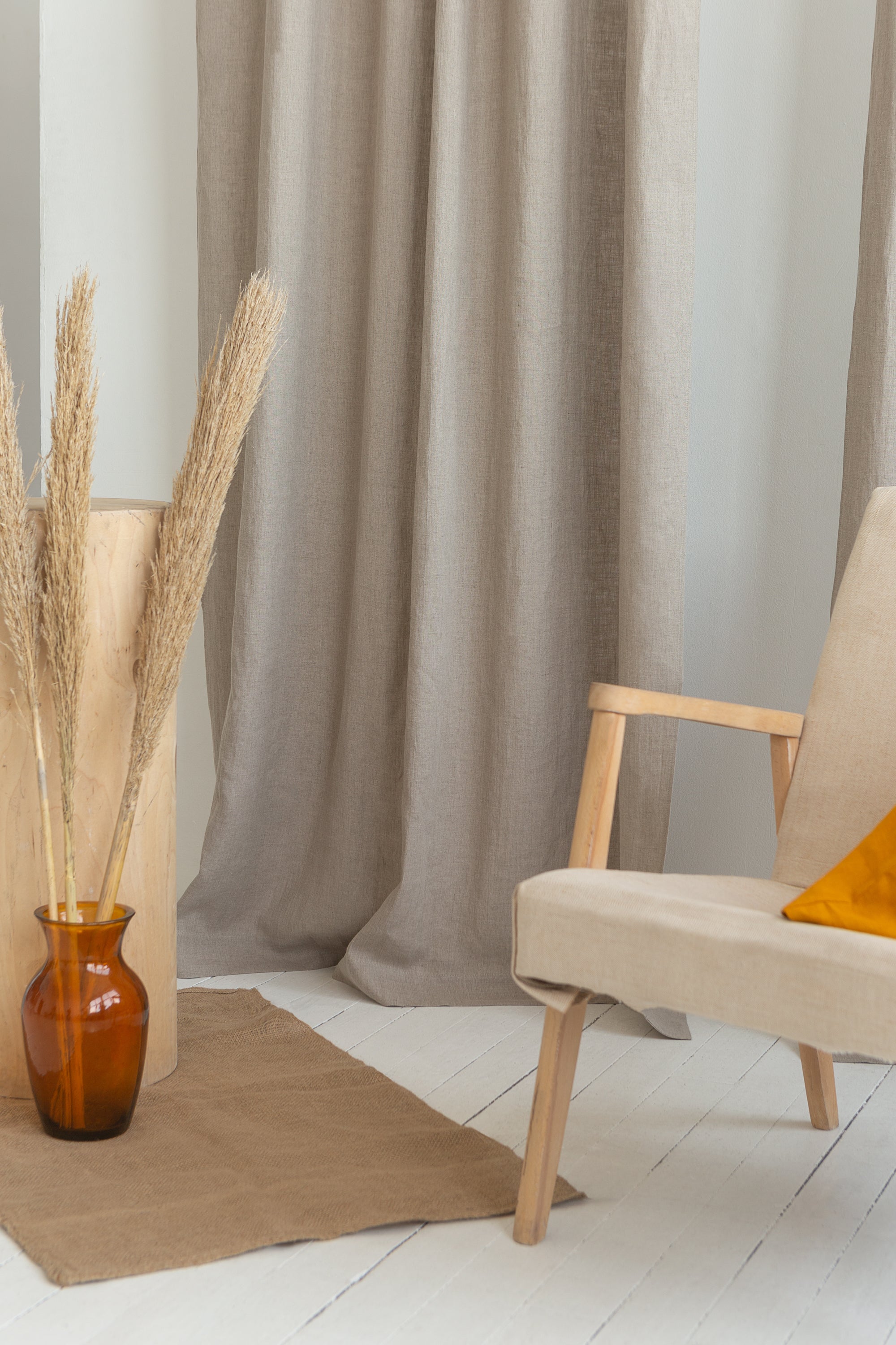 Elegant natural linen curtain with tie top design, showcasing soft texture and semi-sheer fabric.