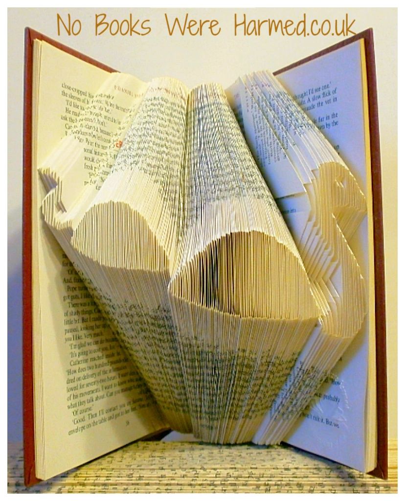 Hand-folded art piece of the Loch Ness Monster made from vintage book pages, showcasing intricate craftsmanship and unique design.