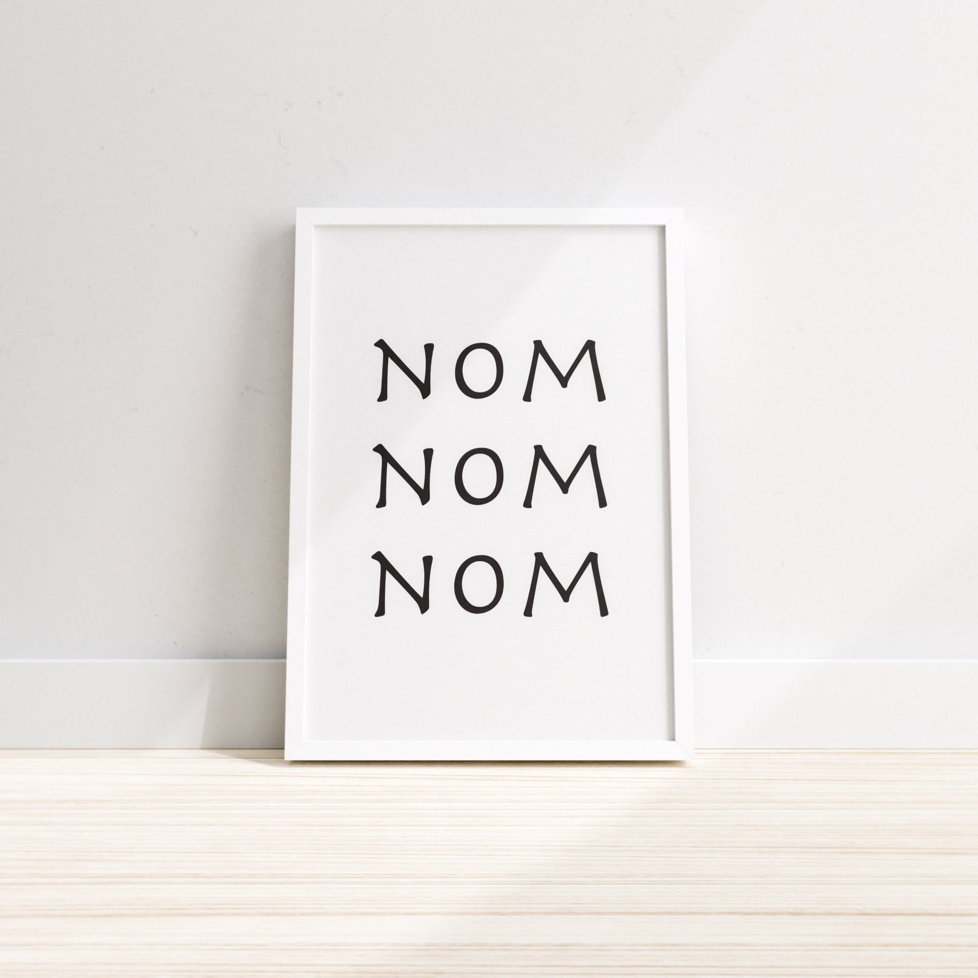 Nom Nom Nom kitchen wall print featuring playful text design, perfect for kitchen and dining room decor.