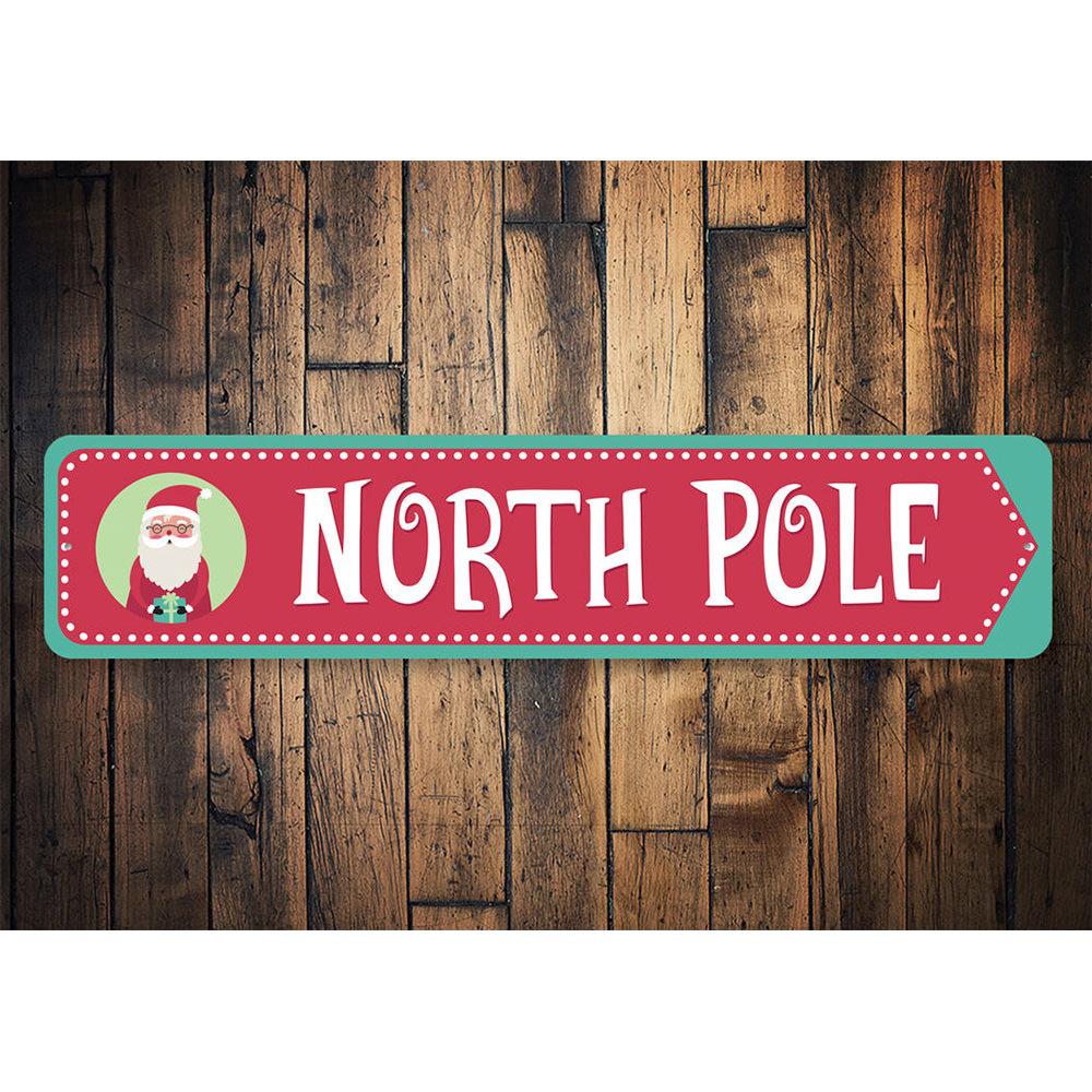 North Pole Santa Arrow Sign featuring festive design, made from durable aluminum, perfect for holiday decorations.