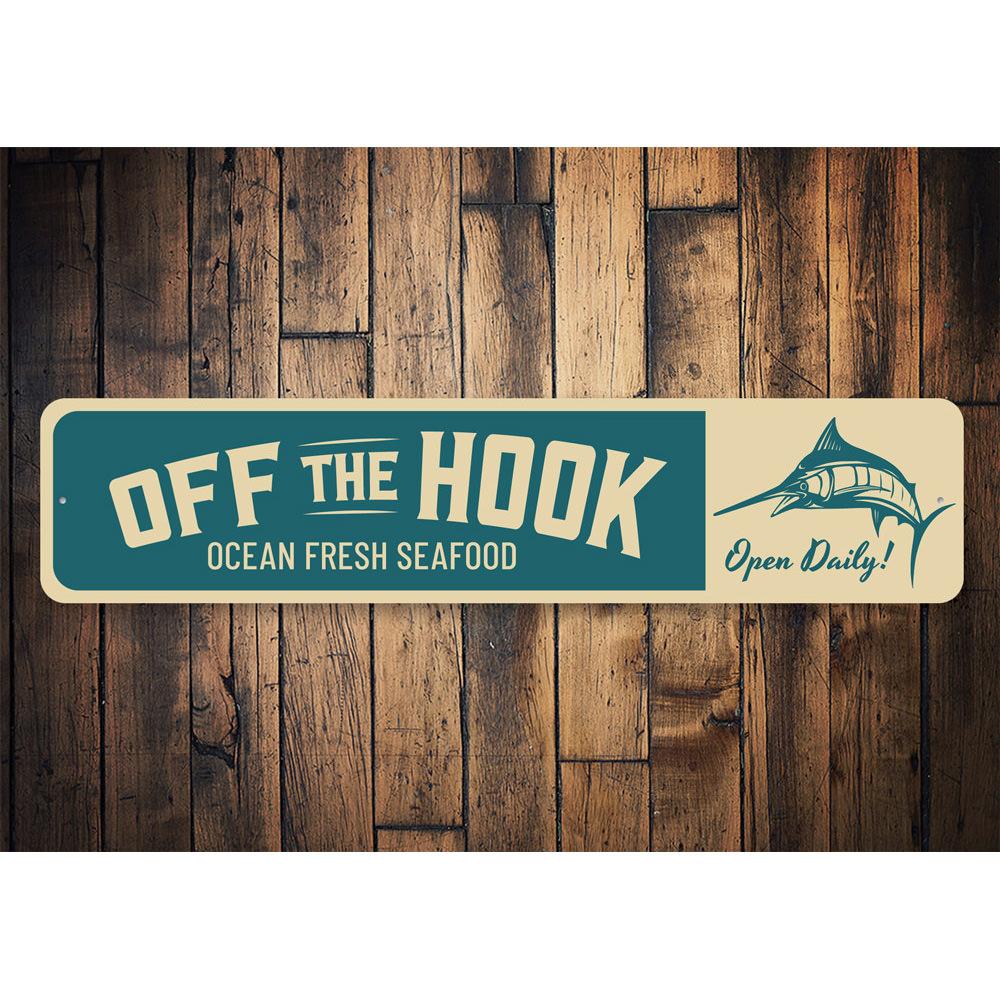 Off the Hook Sign made of high-quality aluminum, featuring a beach-themed design, perfect for coastal decor.