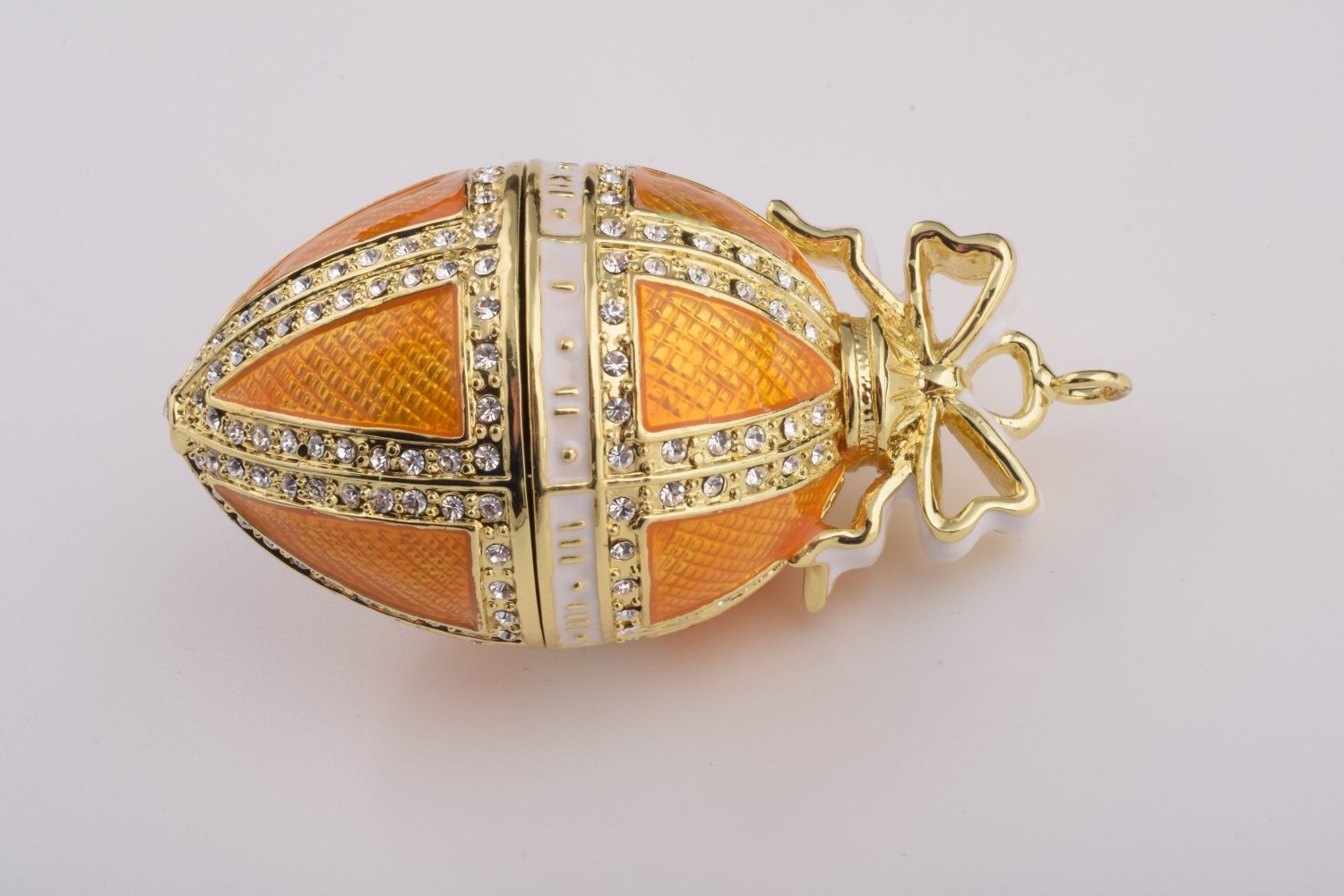 Orange Russian Egg Hanging trinket box with Austrian crystals, handmade by Keren Kopal, featuring 24K gold plating and a secure magnetic closure.