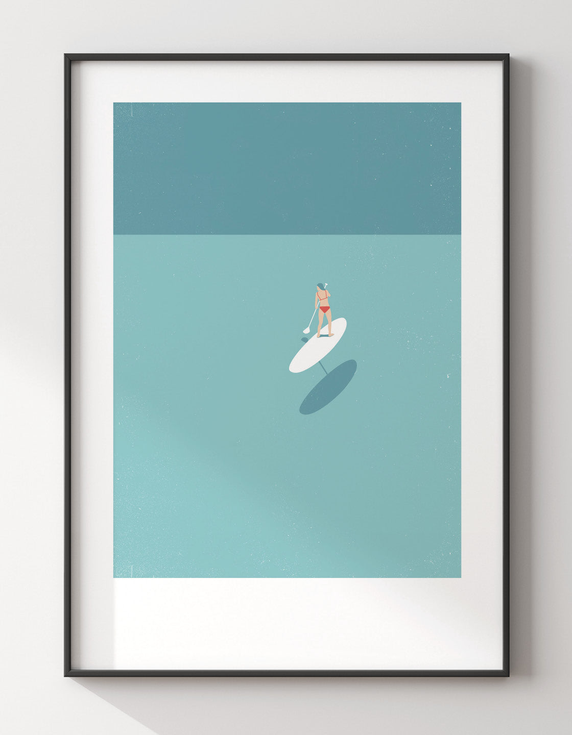 A serene art print featuring a woman paddleboarding in shallow waters, perfect for bathroom decor.