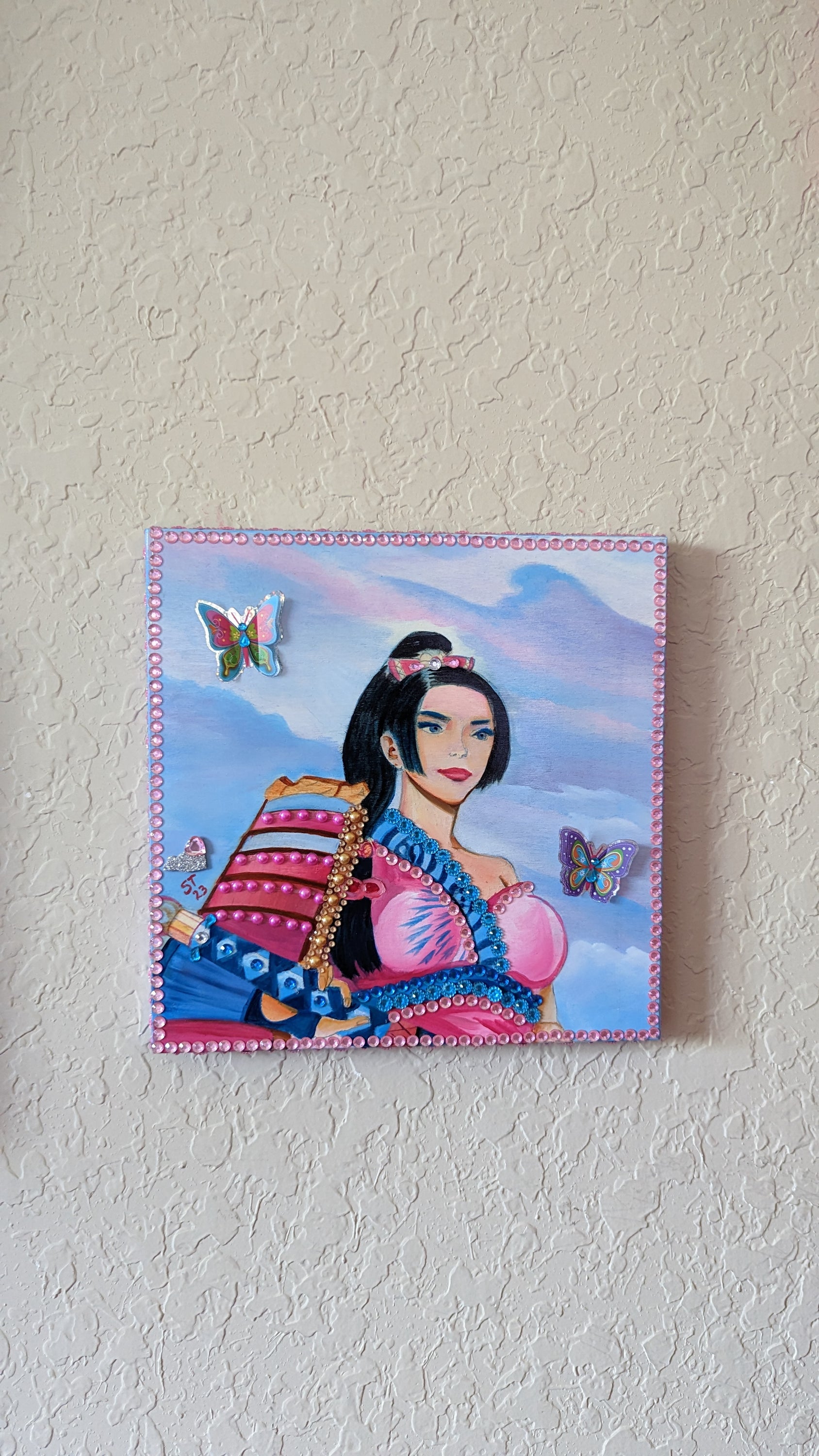 A beautifully hand-decorated Wish Box by Sharon Tatem, featuring intricate designs and a powerful maiden, symbolizing dreams and aspirations.