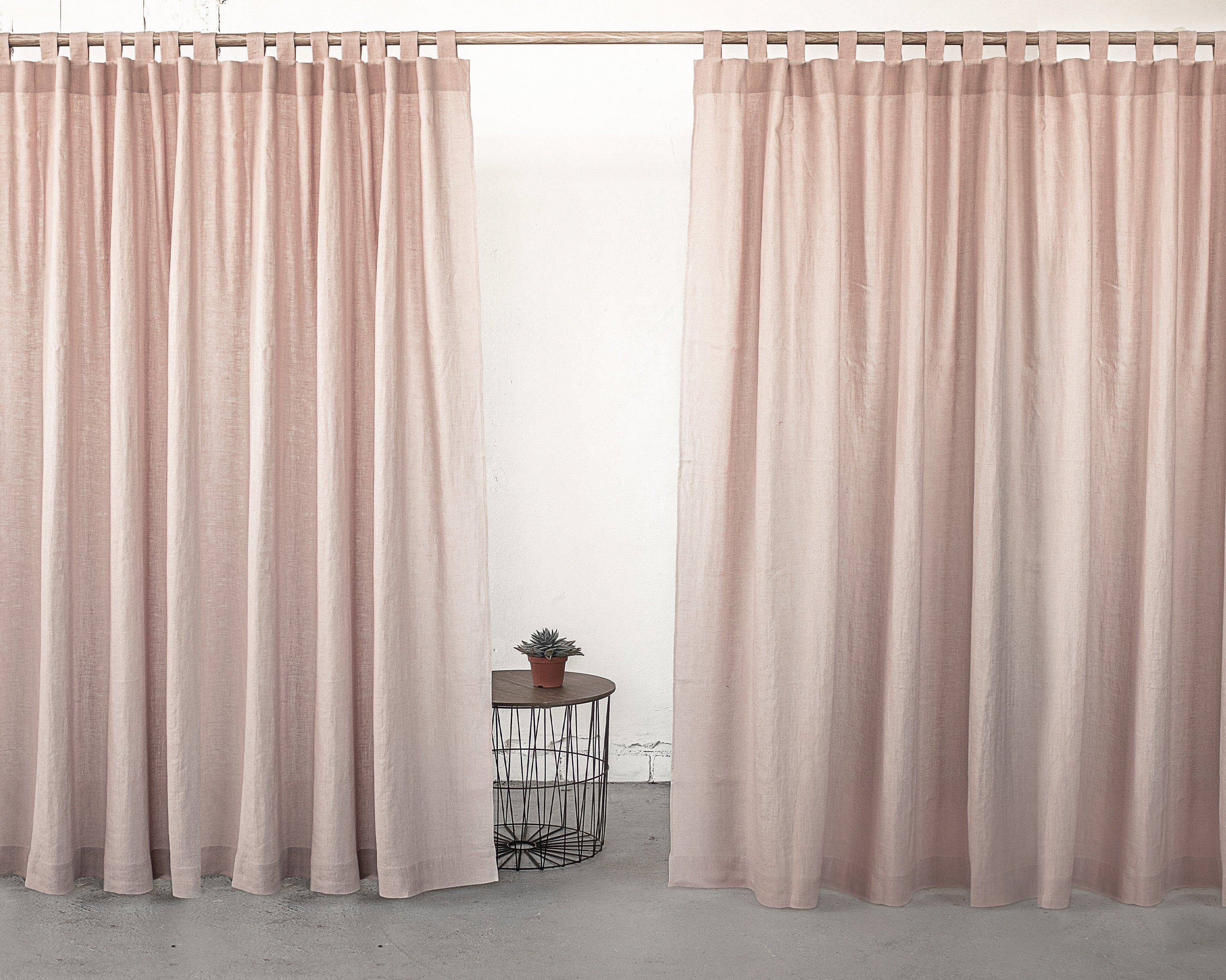 Pale Pink linen curtain with tab tops, showcasing a soft texture and elegant drape.