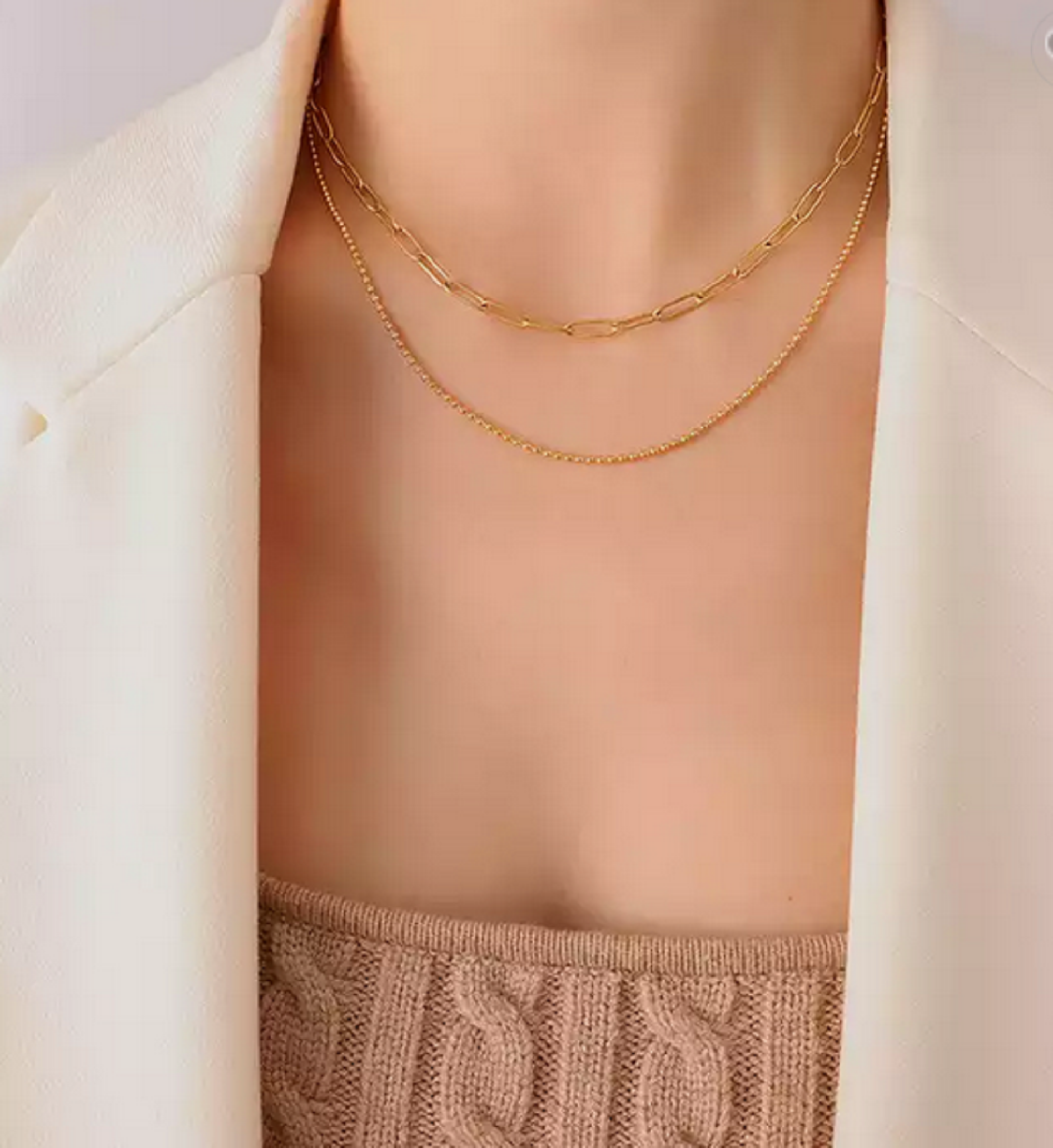 A stylish Paper Clip Necklace by Kaelyn and Co, featuring a minimalist design with 18k gold plating, perfect for layering or wearing as a choker.