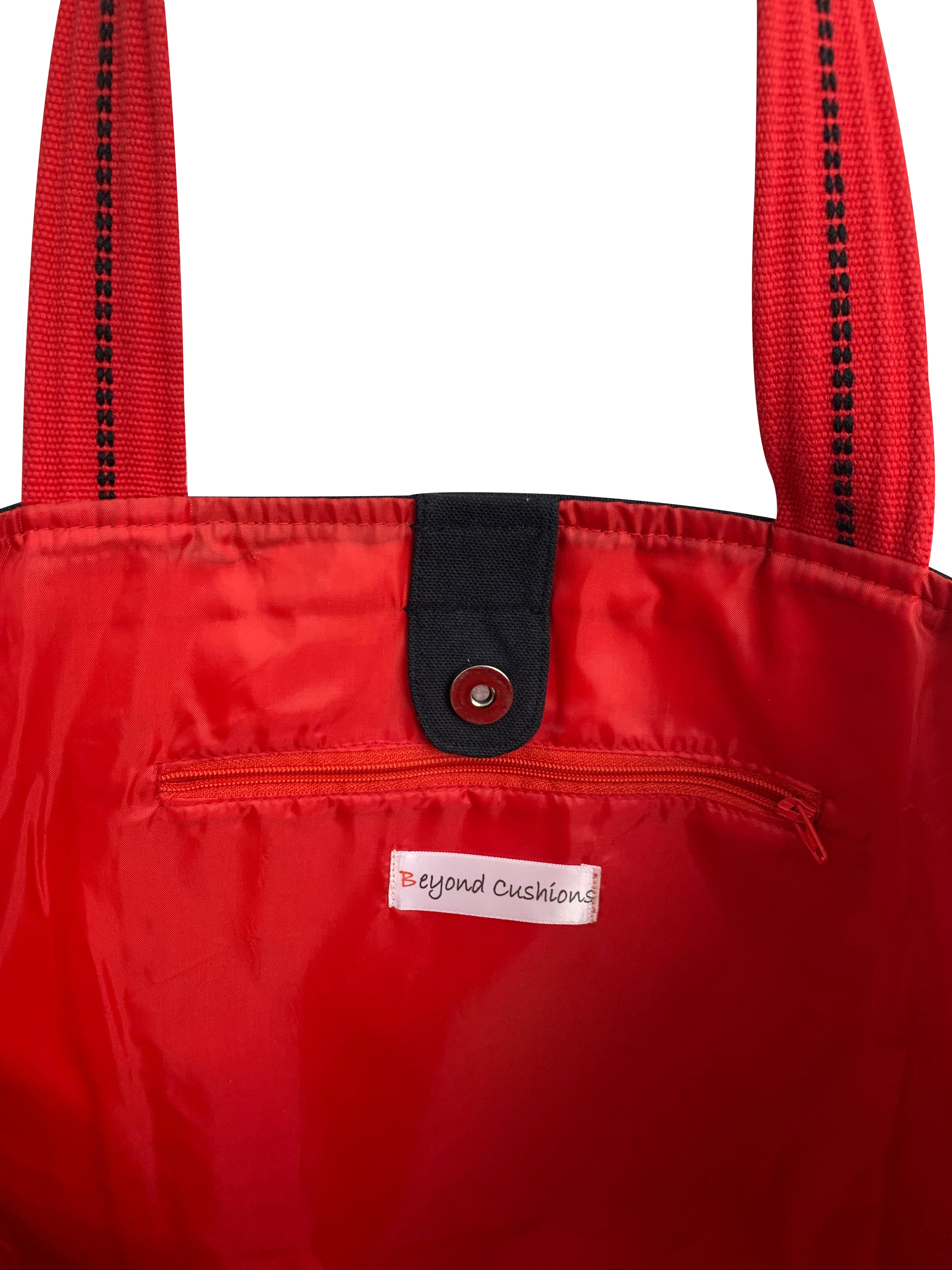 Stylish Paris Tote Bag with embroidered skyline in cream and black colors, featuring red waterproof lining and ribbed straps.