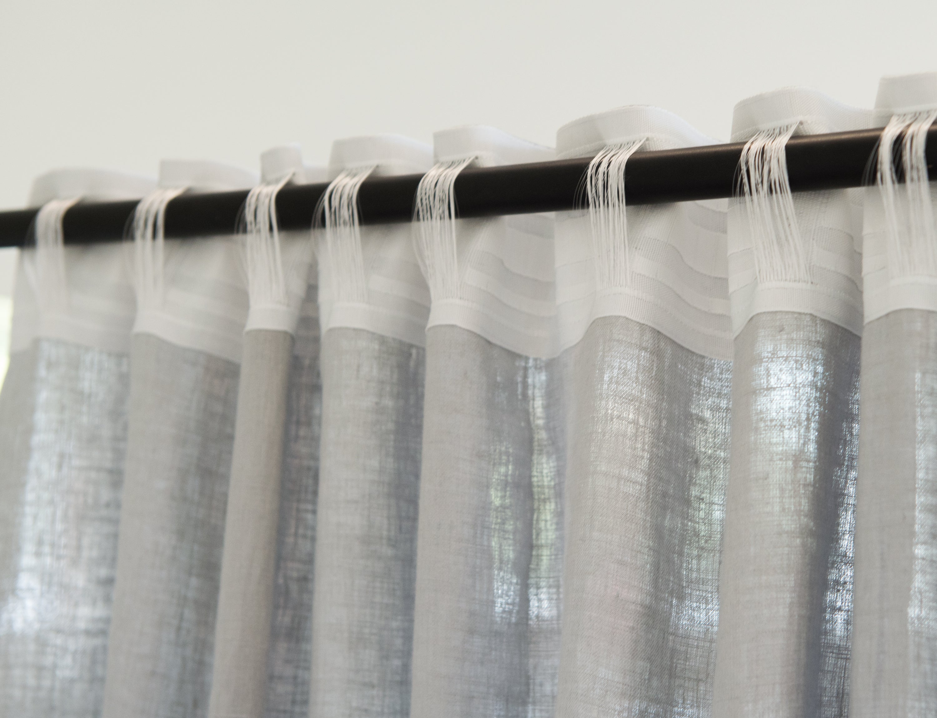 Pastel Plum linen curtain with multifunctional heading tape, elegantly draped to showcase its soft texture and color.