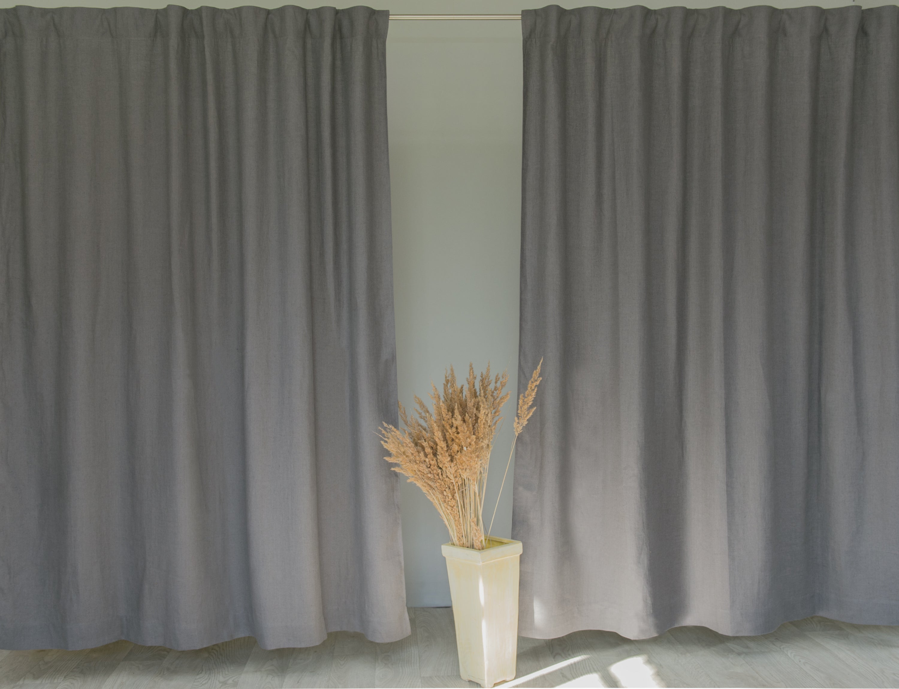 Pastel Plum linen curtain with multifunctional heading tape, elegantly draped to showcase its soft texture and color.