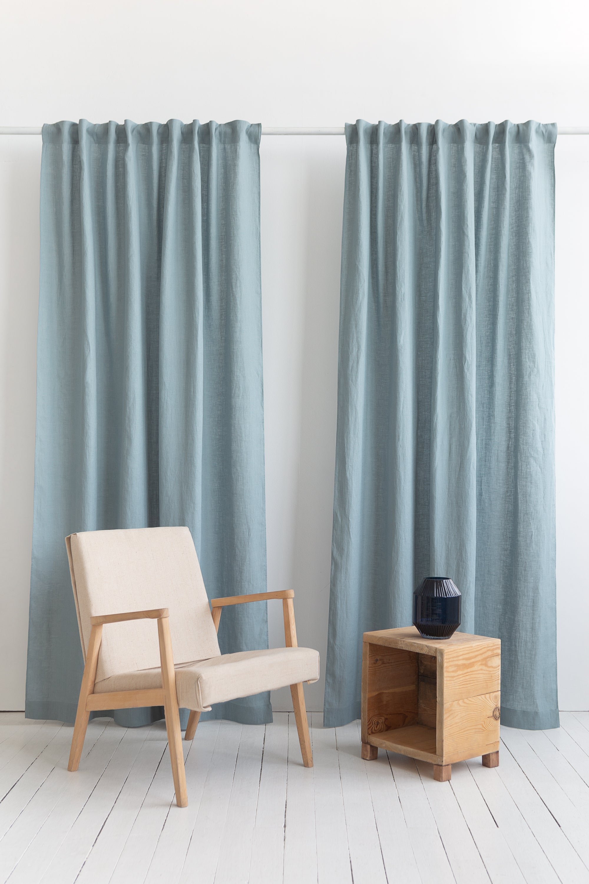 Pastel Plum linen curtain with multifunctional heading tape, elegantly draped to showcase its soft texture and color.