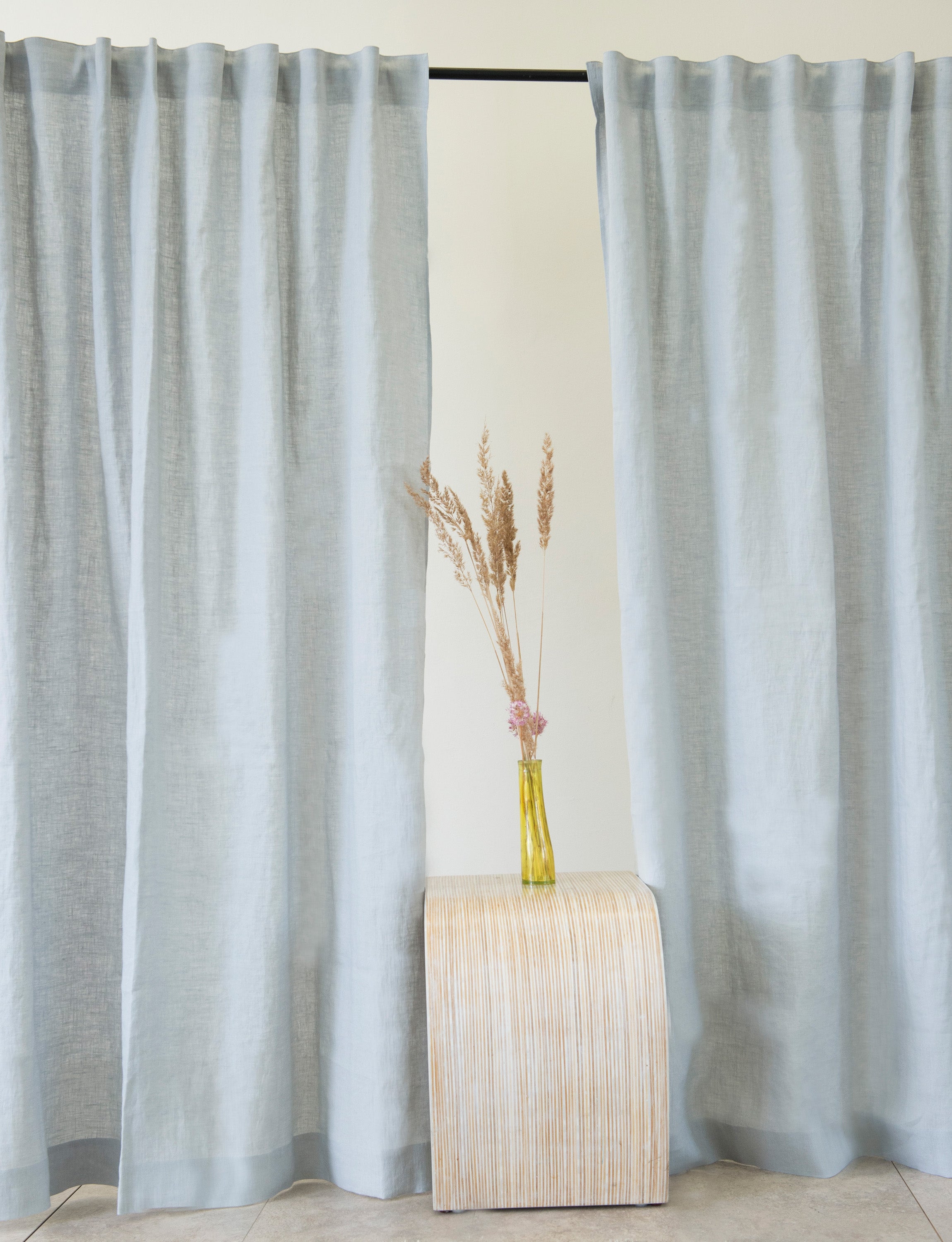 Pastel Plum linen curtain with multifunctional heading tape, elegantly draped to showcase its soft texture and color.