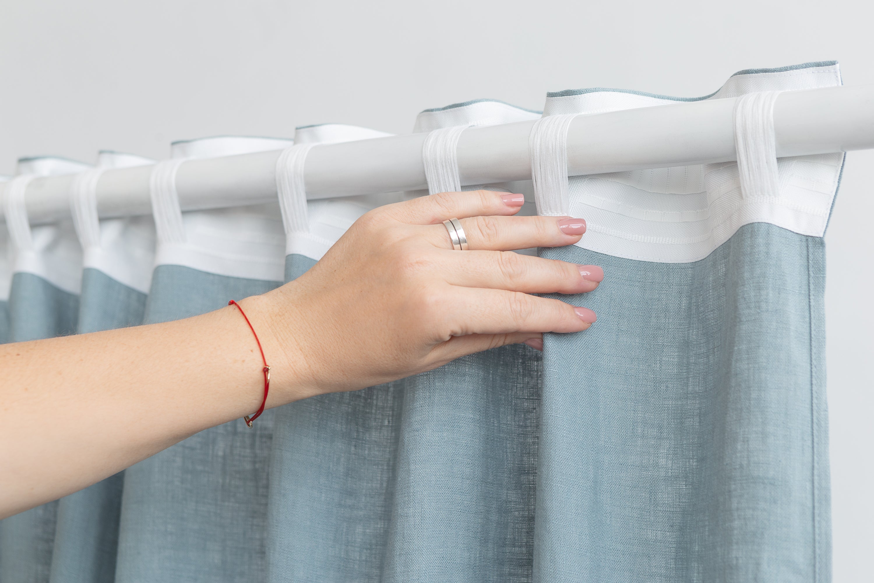 Pastel Plum linen curtain with multifunctional heading tape, elegantly draped to showcase its soft texture and color.