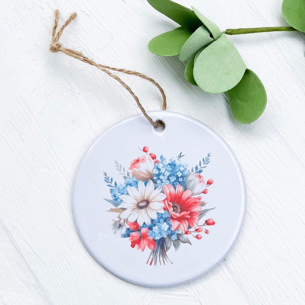 A beautifully crafted porcelain ornament featuring a patriotic daisy bouquet design, showcasing vibrant colors and a glossy finish.