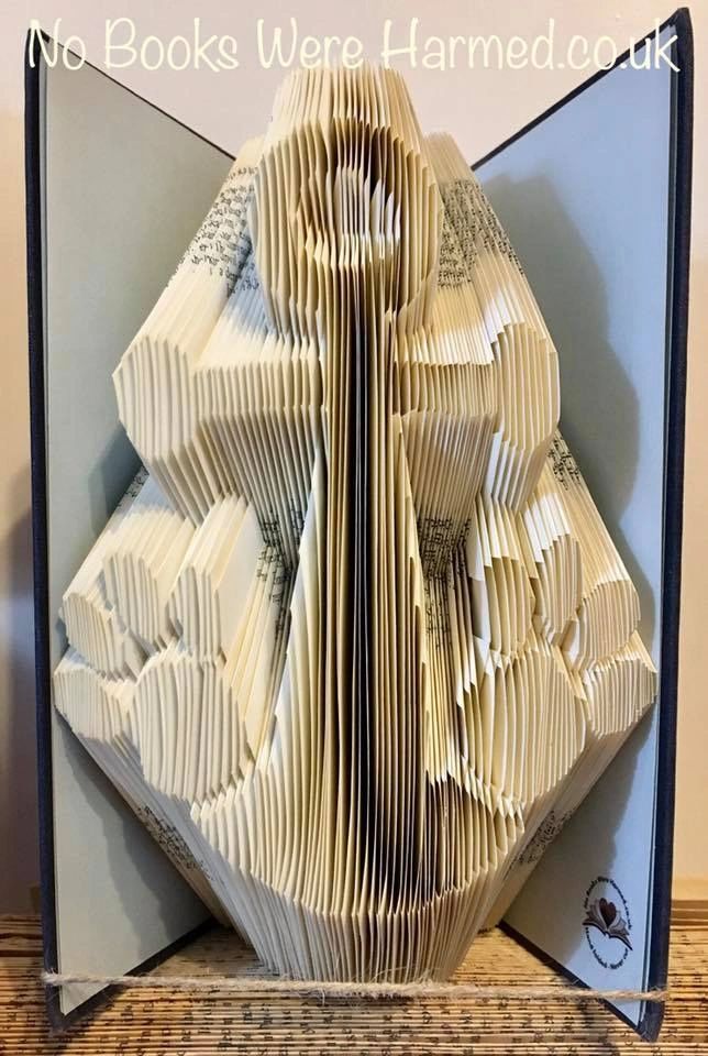 Handcrafted Paws Anchor art piece made from vintage book pages, showcasing unique folds and textures.