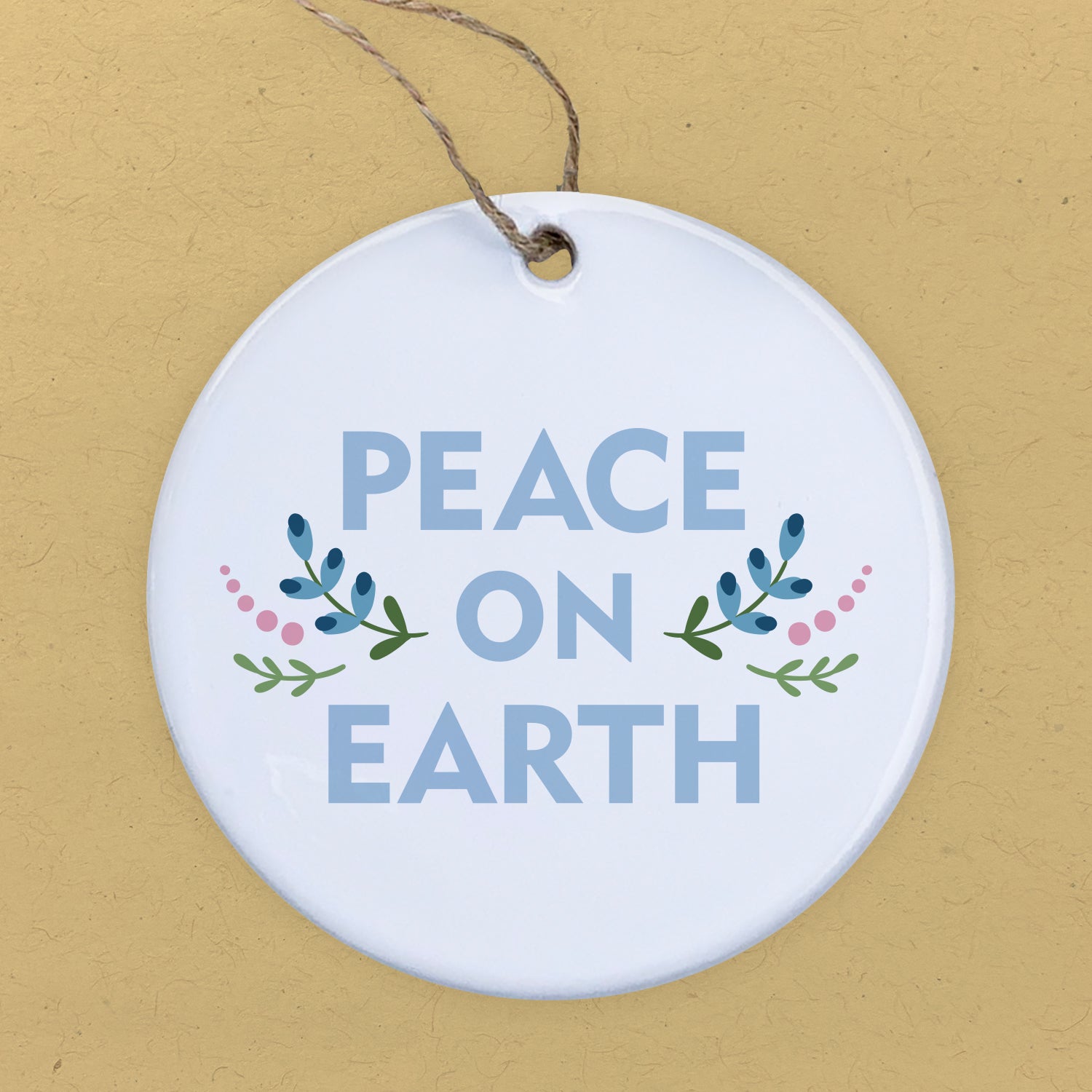 A beautifully crafted porcelain ornament featuring the design 'Peace on Earth', showcasing vibrant colors and a glossy finish.