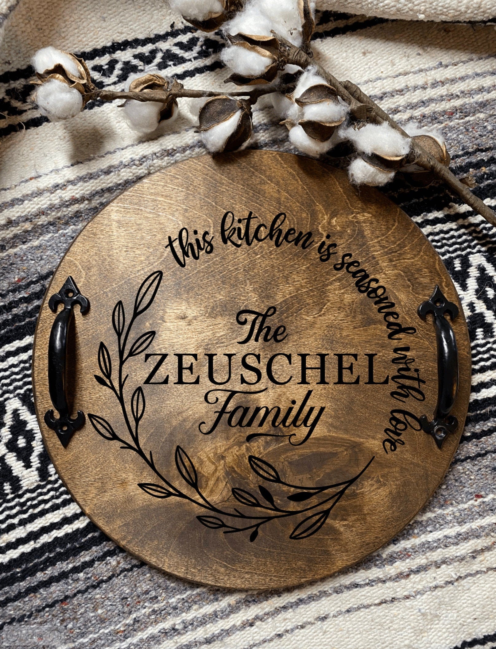 A beautifully crafted personalized family name serving tray made of birch plywood, stained dark chestnut with black metal handles.