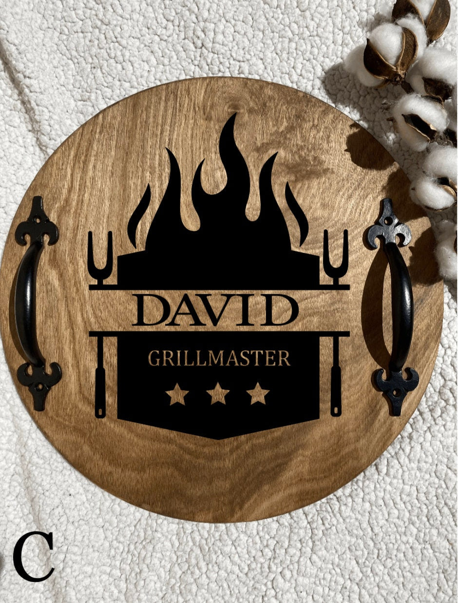 Personalized wooden grilling tray with dark chestnut finish and black metal handles, featuring custom name burned into the wood.