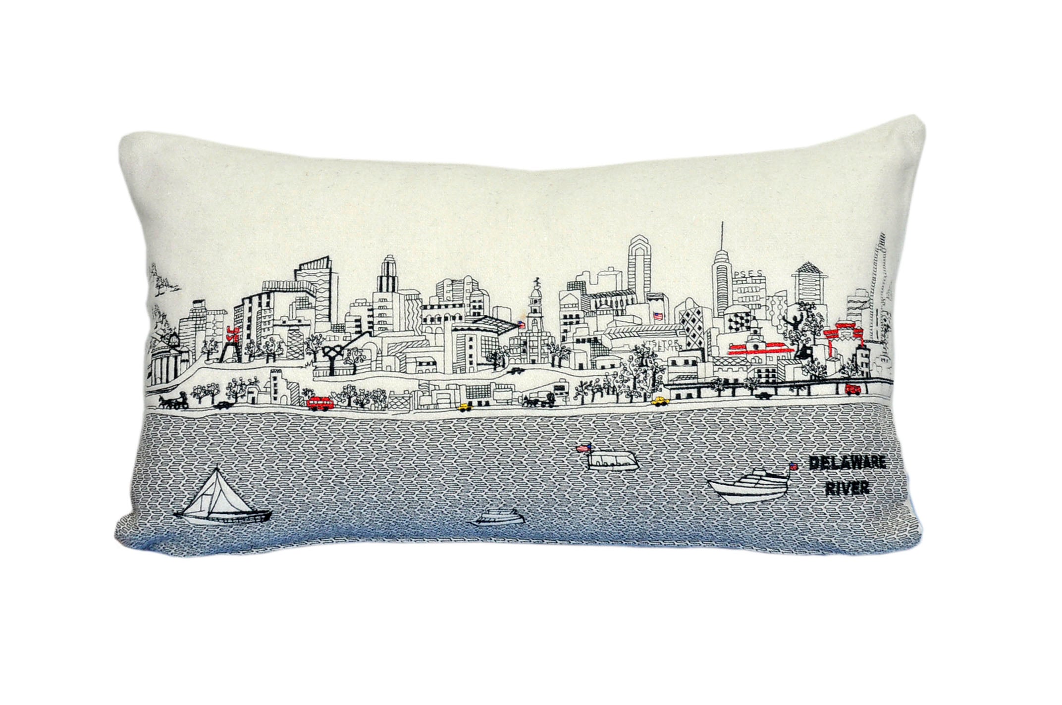 Embroidered Philadelphia Pillow showcasing historical landmarks and modern attractions with a red zipper.