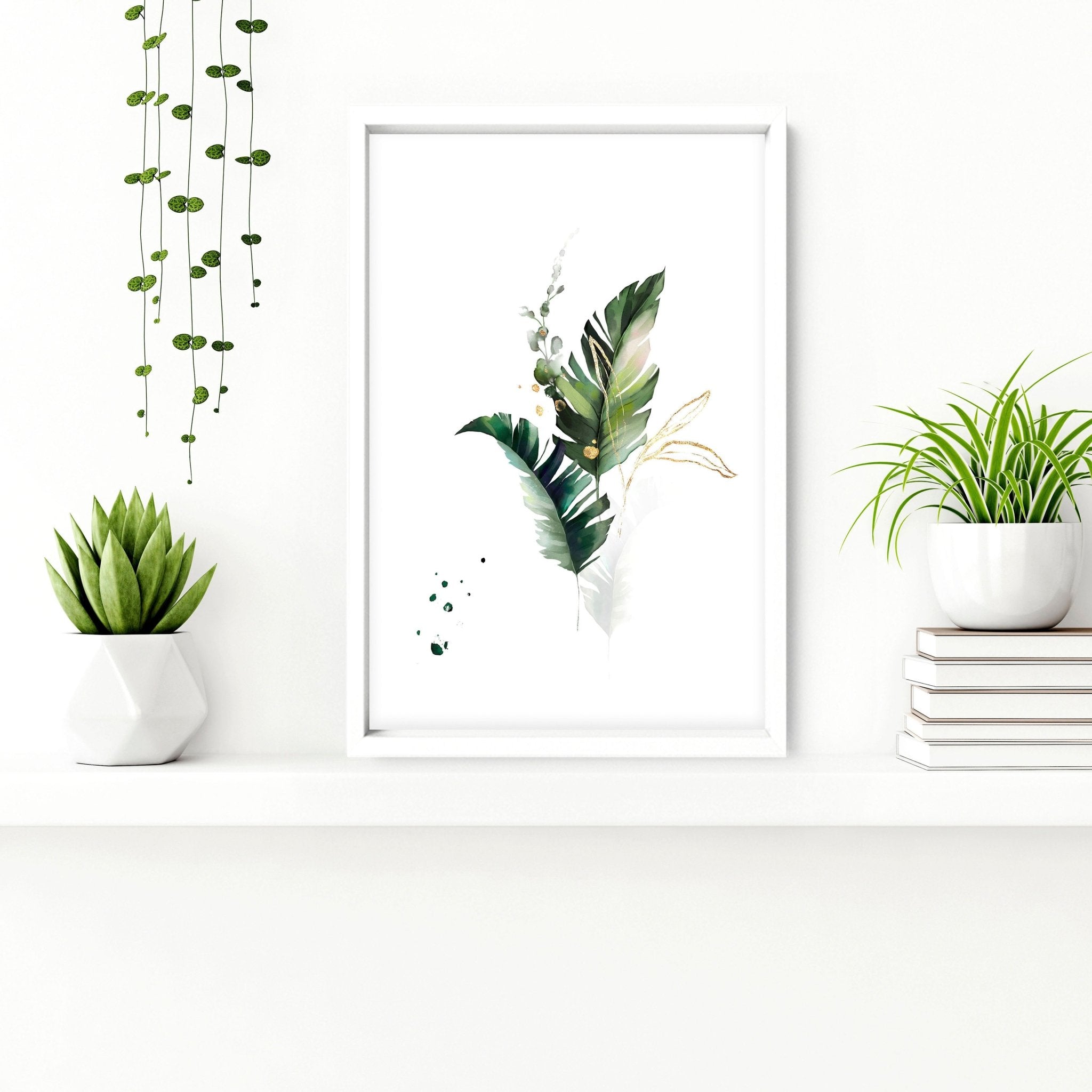Set of 3 tropical wall art prints featuring lush greenery in greens and gold colors, perfect for bathroom decor.