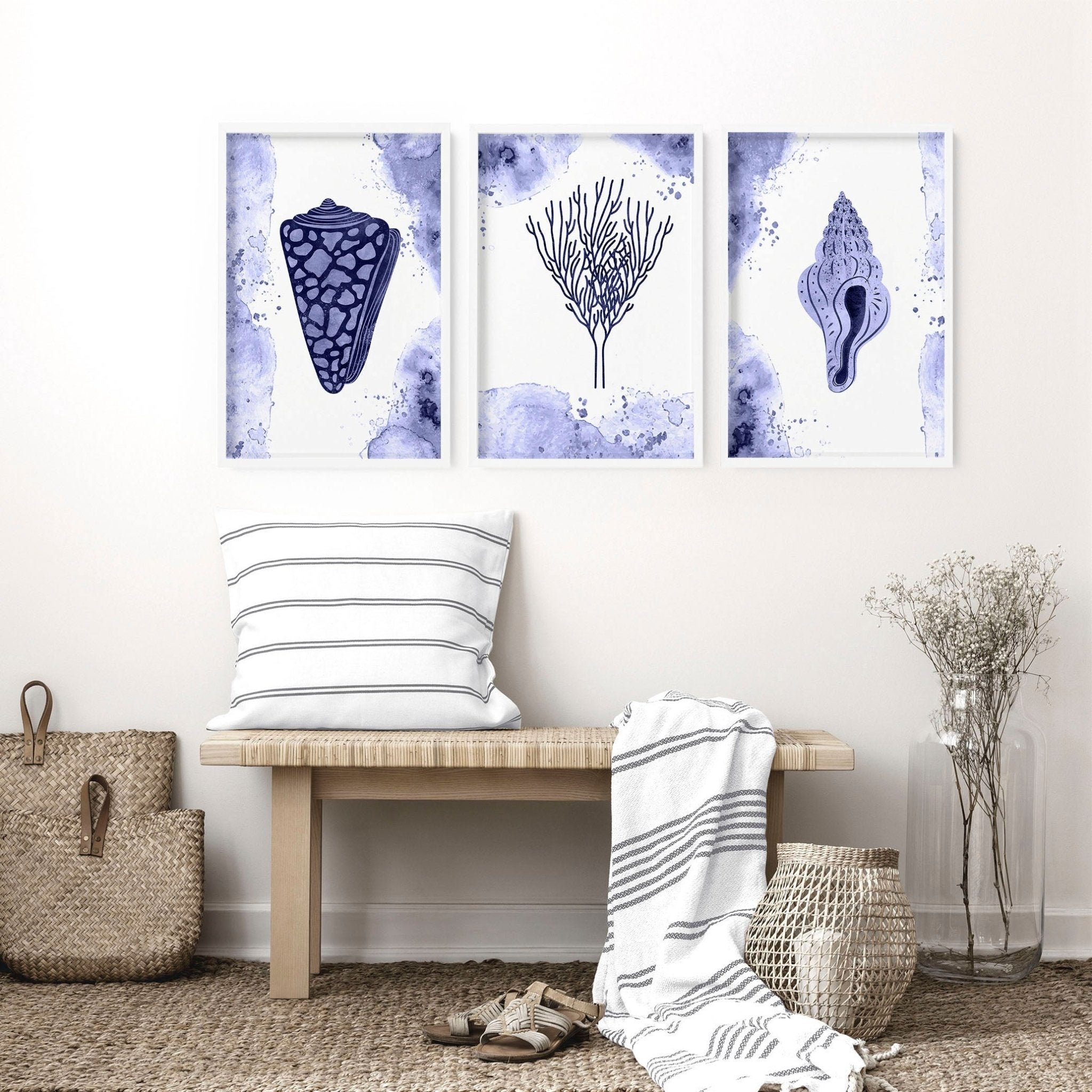 Set of 3 modern beach theme wall art prints featuring beautiful seashell illustrations in calming blue tones.