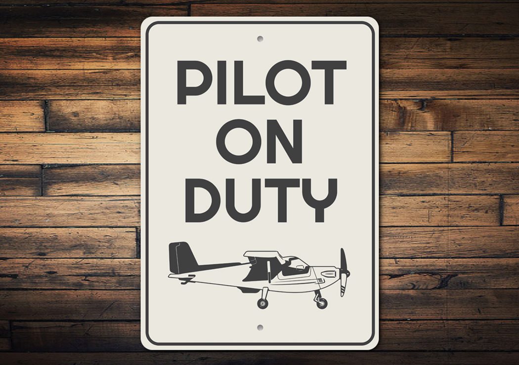 Pilot on Duty Plane Sign made of aluminum, featuring aviation-themed design, perfect for wall decoration.