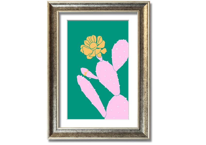 A vibrant pink cactus with a bright yellow flower, beautifully framed, ready to hang.