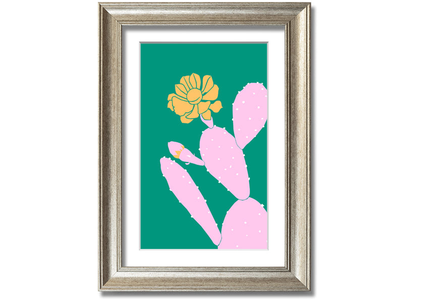 A vibrant pink cactus with a bright yellow flower, beautifully framed, ready to hang.