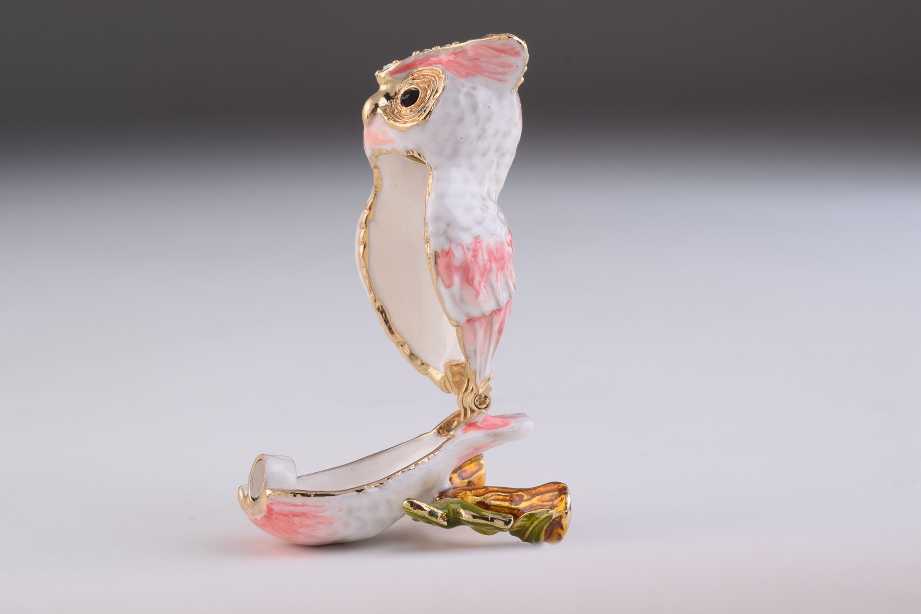 Handcrafted Pink Owl trinket box with Austrian crystals and gold plating, featuring a secure magnetic closure.