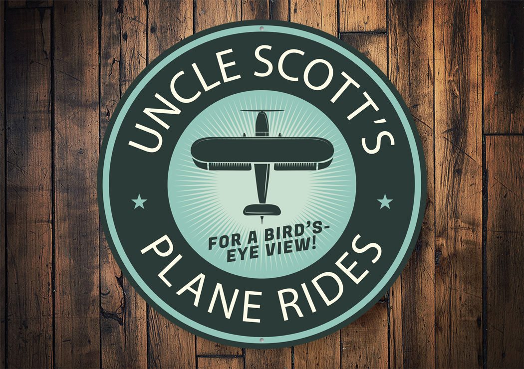 Plane Rides Bird's Eye View Hangar Sign made of aluminum, featuring a decorative aviation design, perfect for home or garage decor.