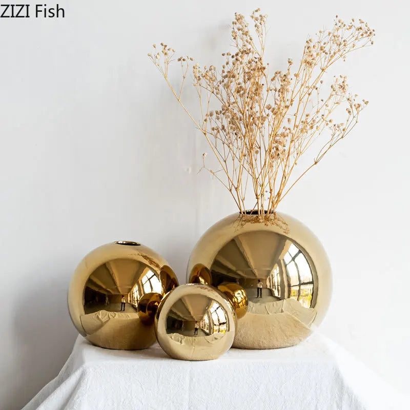 A luxurious Plating Golden Ball Ceramic Vase with a shiny golden finish, elegantly shaped for home decor.