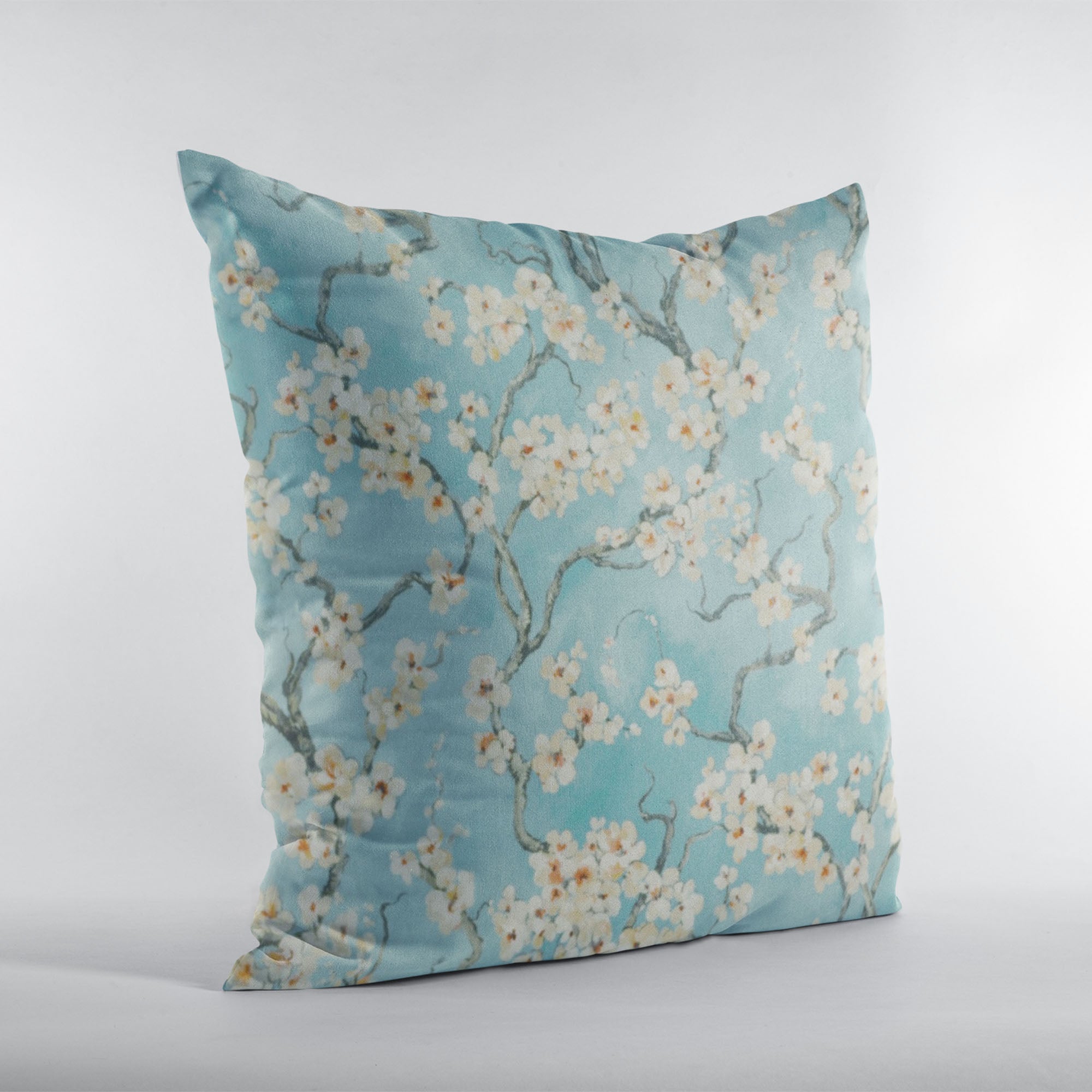 Plutus Azure Garden Cherry Blossoms throw pillow featuring a luxurious linen-like texture and vibrant cherry blossom print, perfect for home decor.