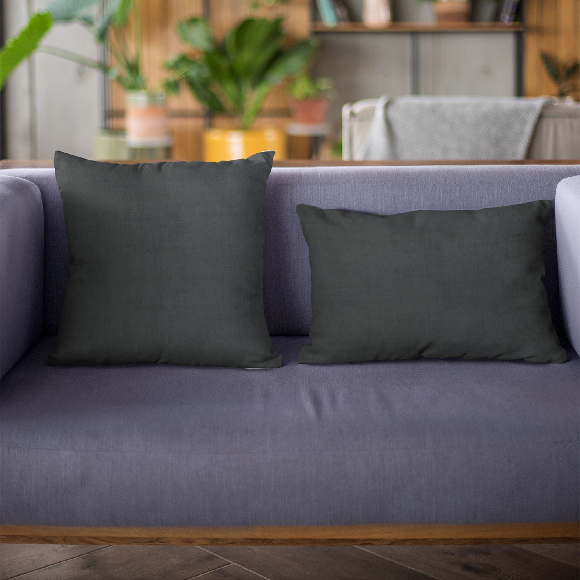 Plutus Black Solid Shiny Velvet Luxury Throw Pillow showcasing its luxurious shiny velvet texture and elegant design.