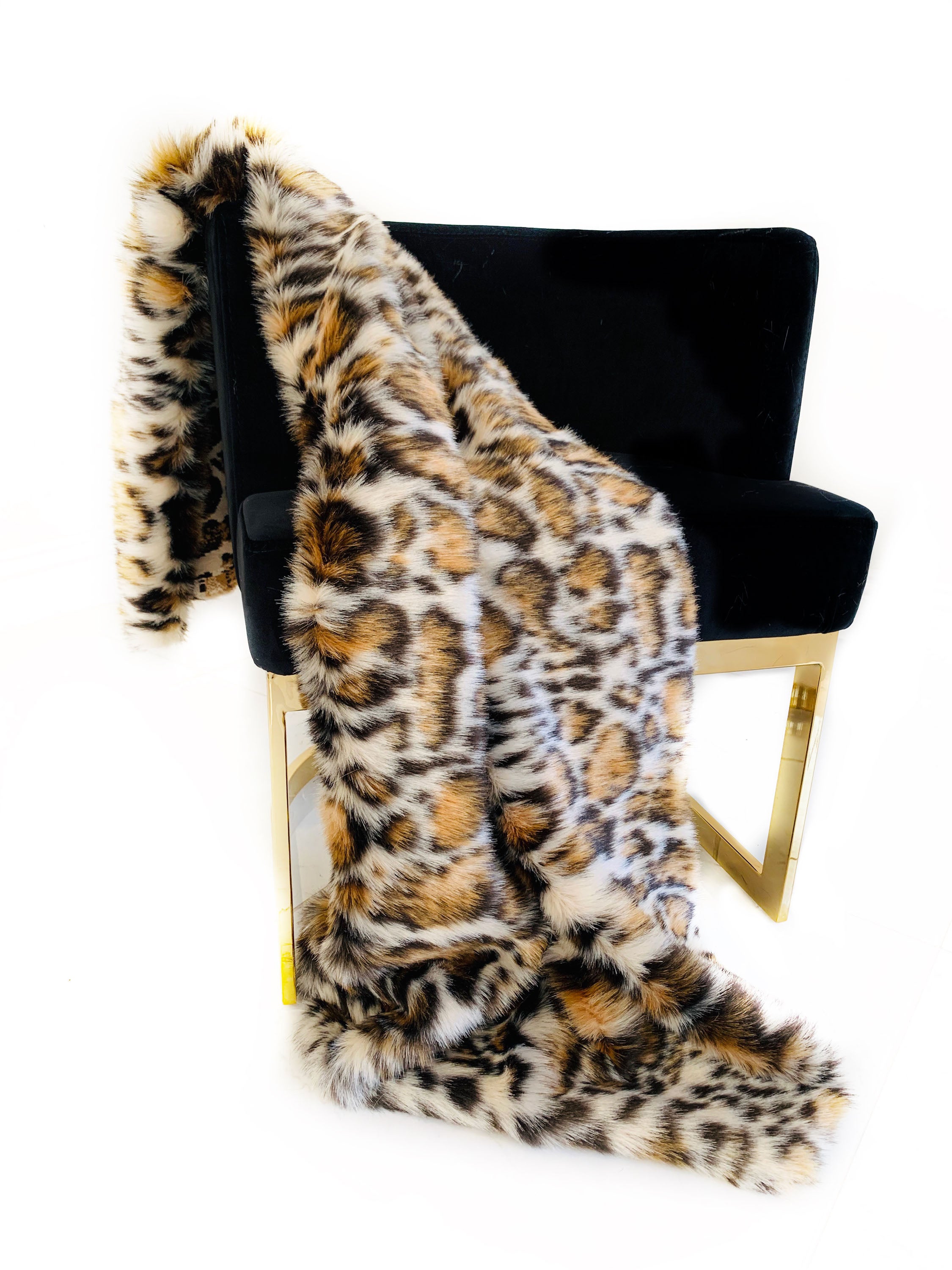 Plutus Brown Tiger Faux Fur Luxury Throw Blanket featuring a taupe and black tiger print, showcasing its plush texture and reversible design.
