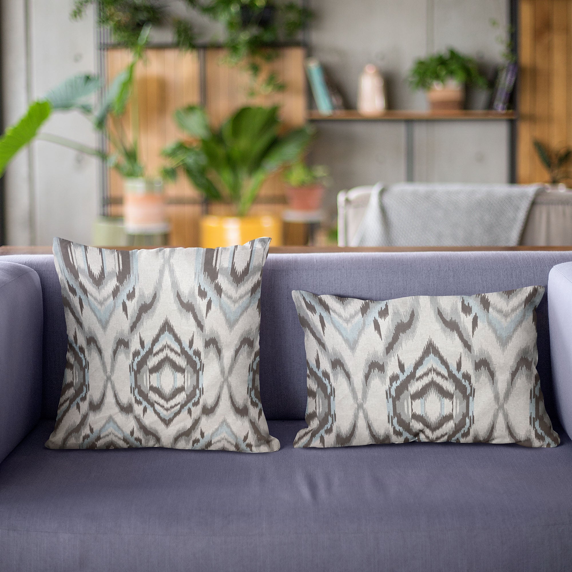 Plutus Ikat Dream Pillow in blue, black, and cream, showcasing a unique Ikat pattern with a luxurious handmade finish.