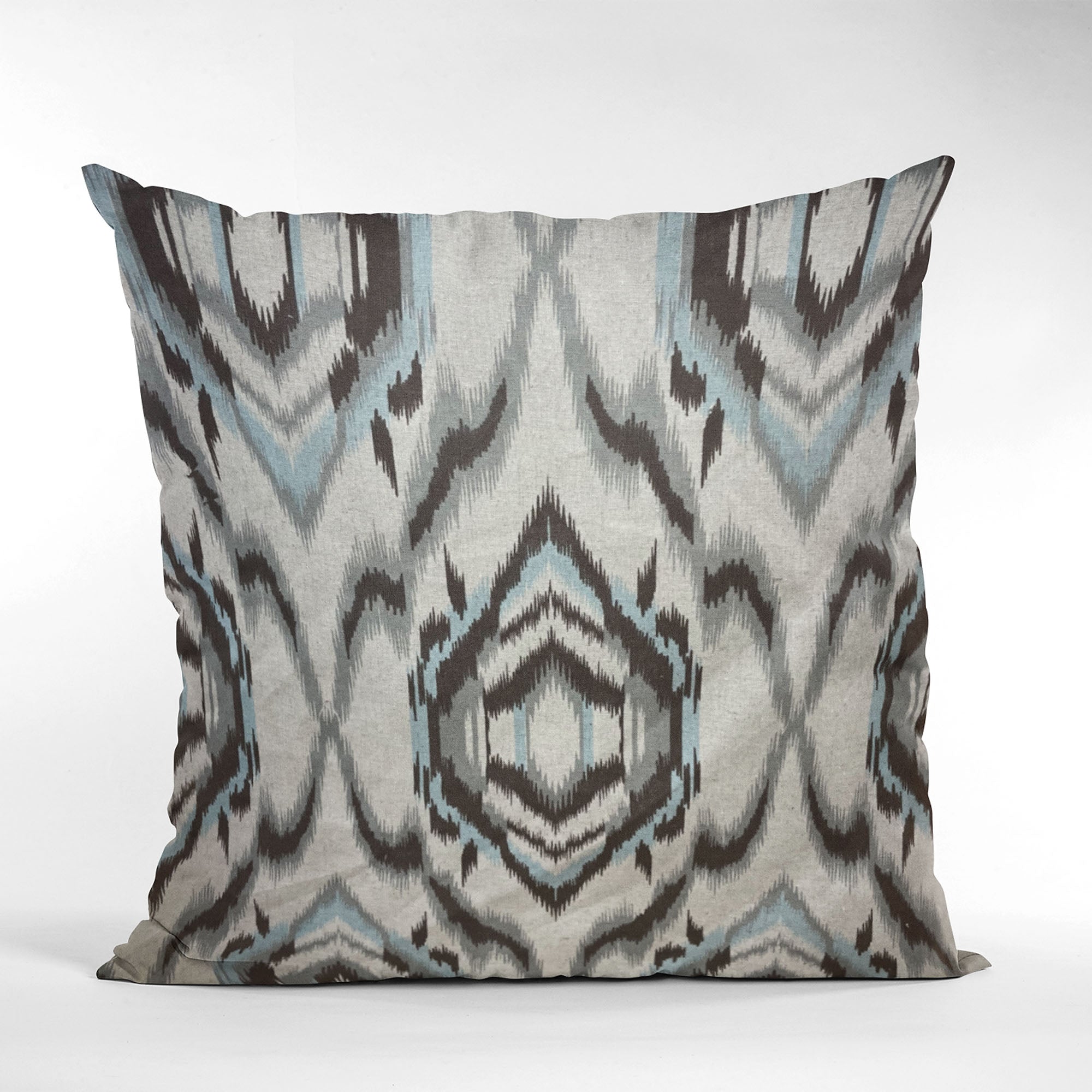 Plutus Ikat Dream Pillow in blue, black, and cream, showcasing a unique Ikat pattern with a luxurious handmade finish.