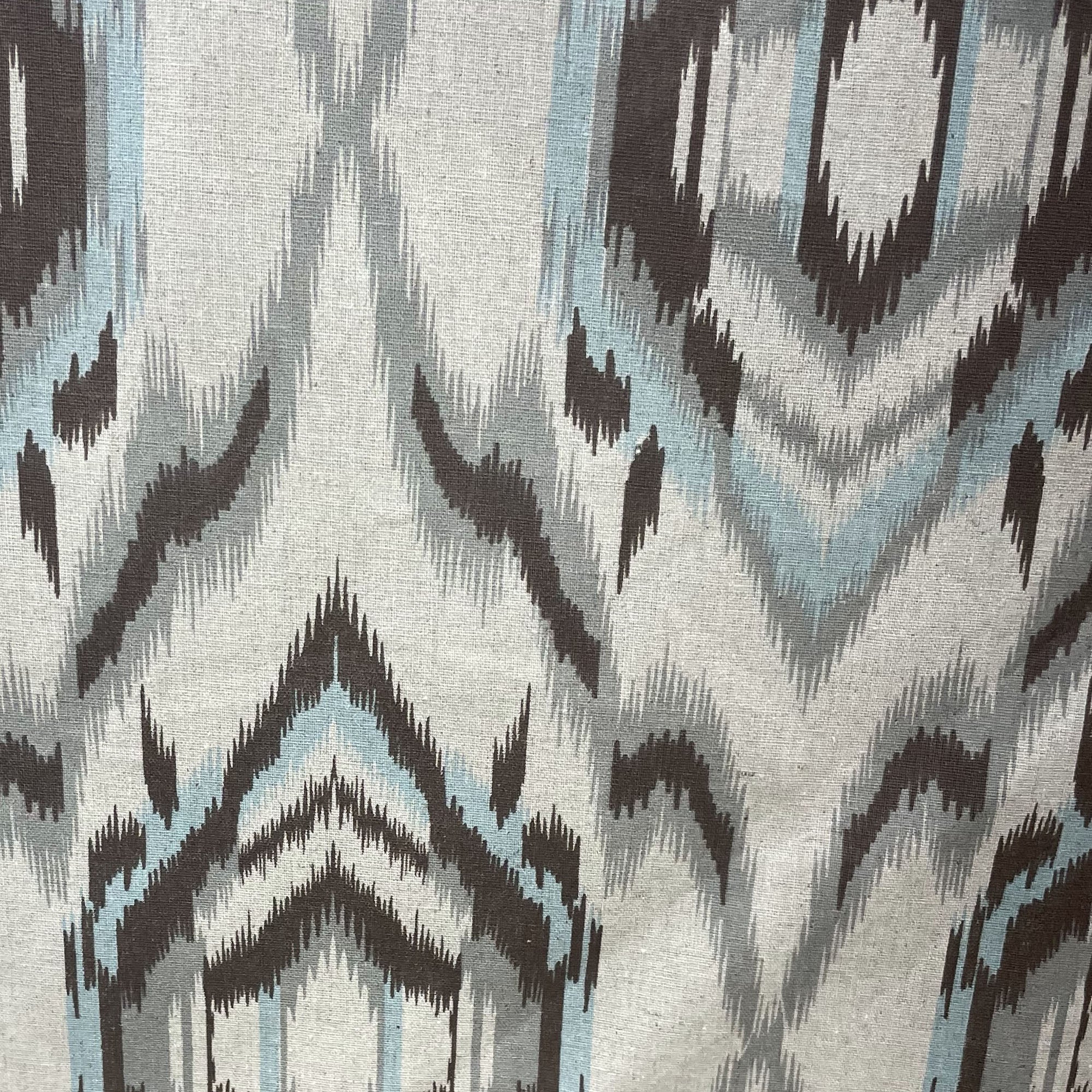 Plutus Ikat Dream Pillow in blue, black, and cream, showcasing a unique Ikat pattern with a luxurious handmade finish.