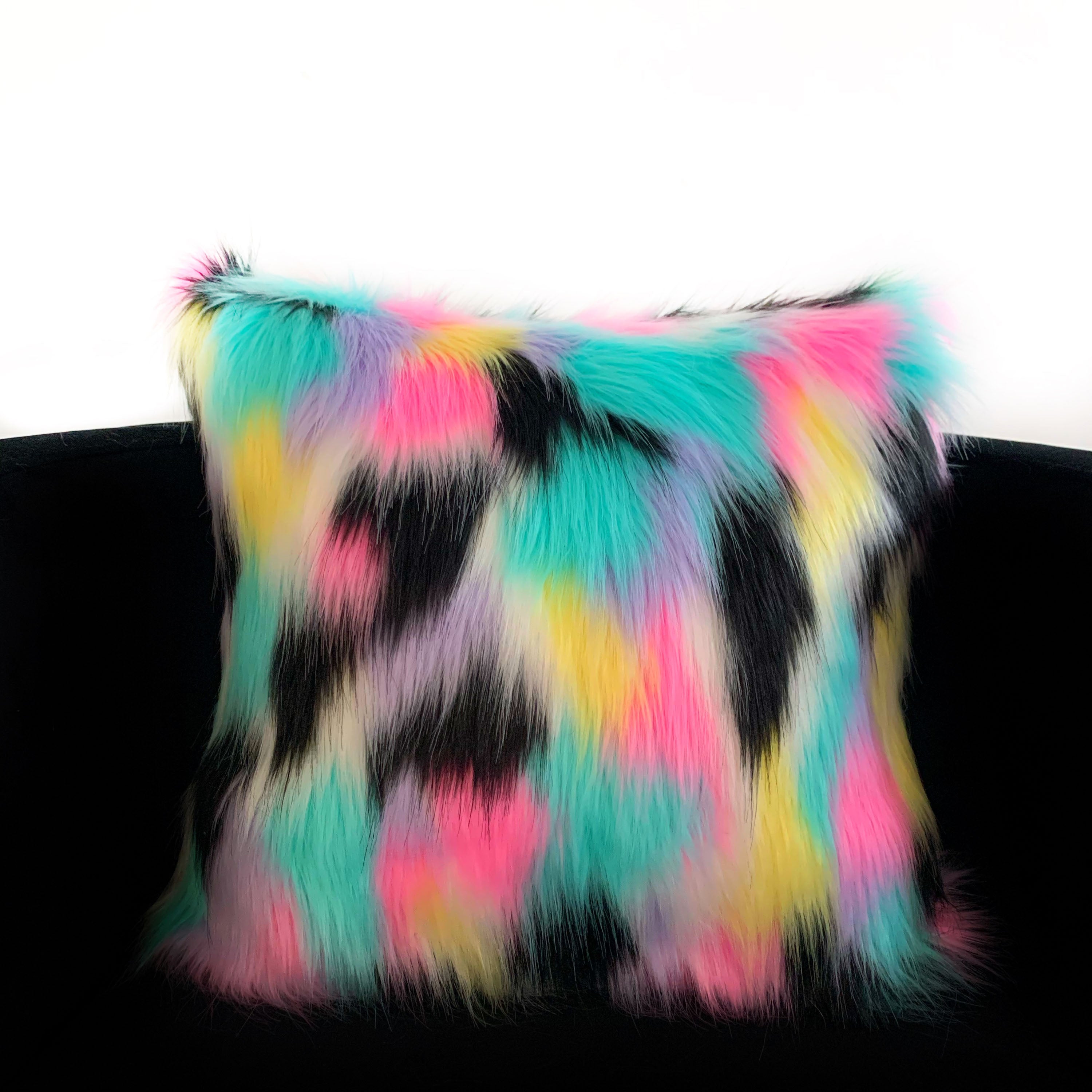 Plutus Exotic Animal Faux Fur Luxury Throw in vibrant pink, blue, black, and yellow colors, showcasing its luxurious faux fur texture.